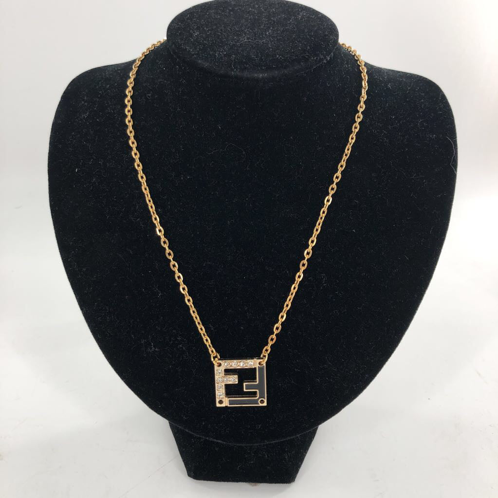 9" Goldtone & black pendant necklace