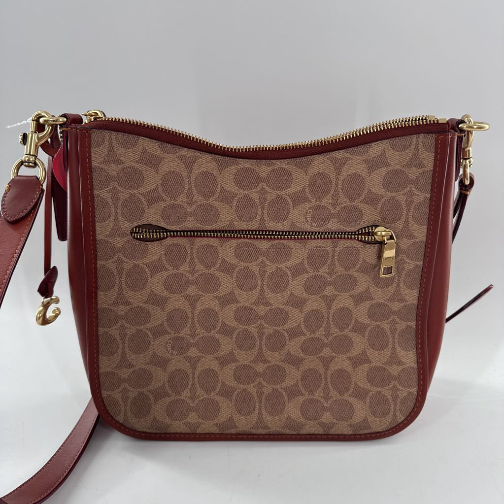 signature turnlock top zip crossbody