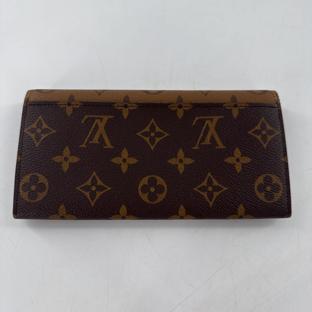 Reverse monogram bi-fold wallet