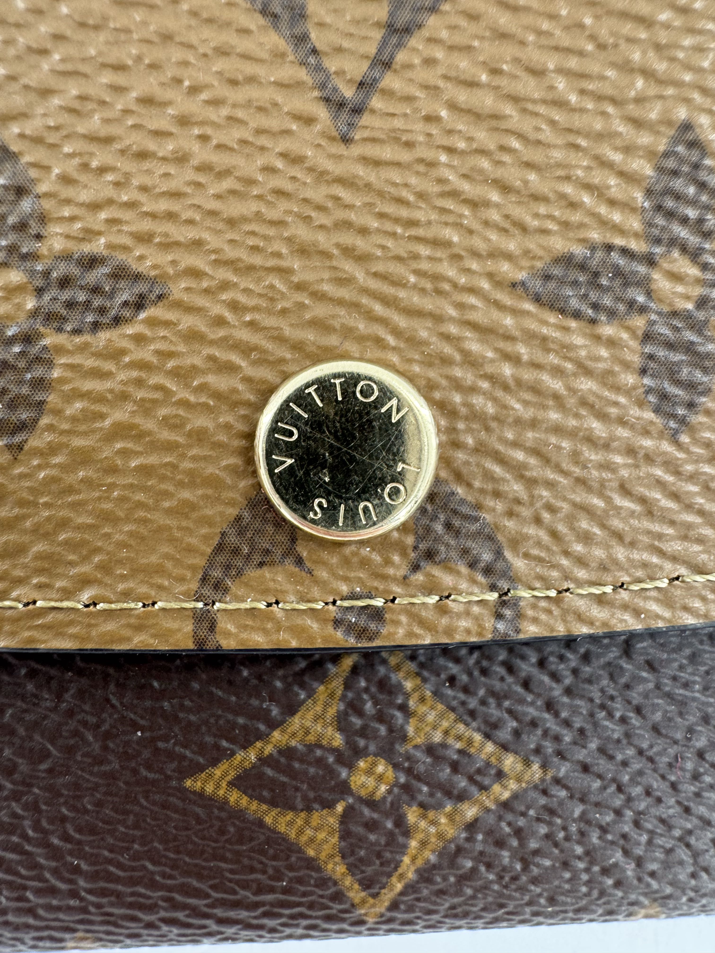 Reverse monogram bi-fold wallet