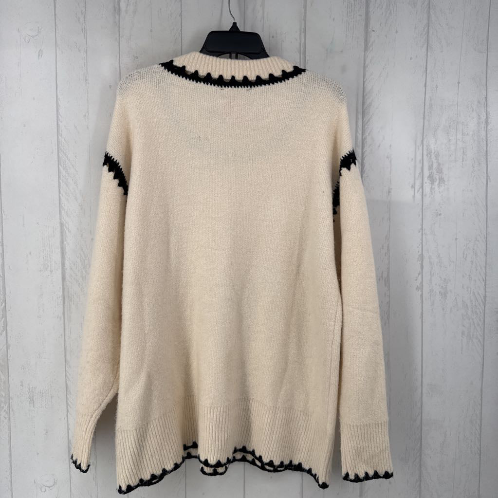 M crochet accent sweater