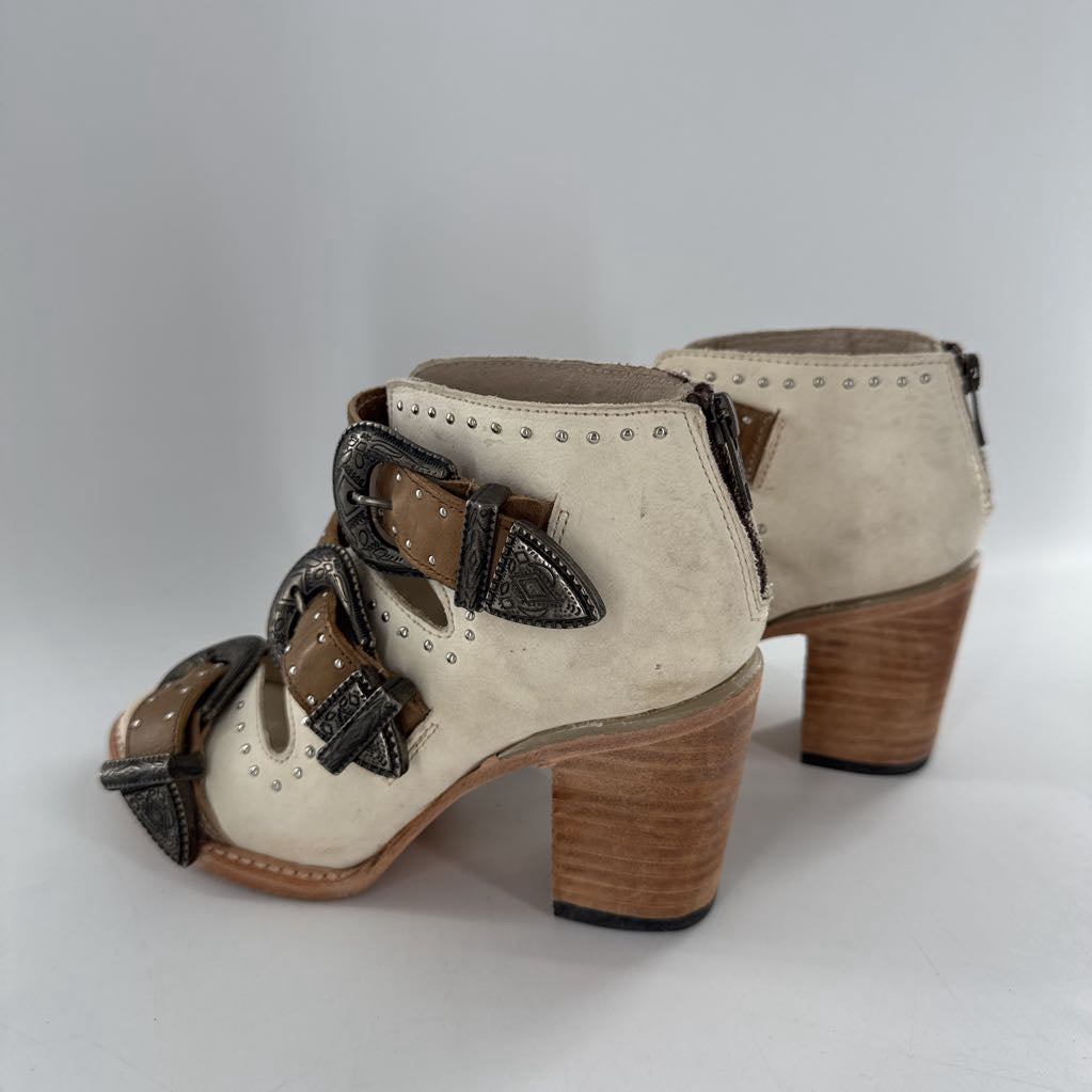 7 studded buckle accents heeled booties