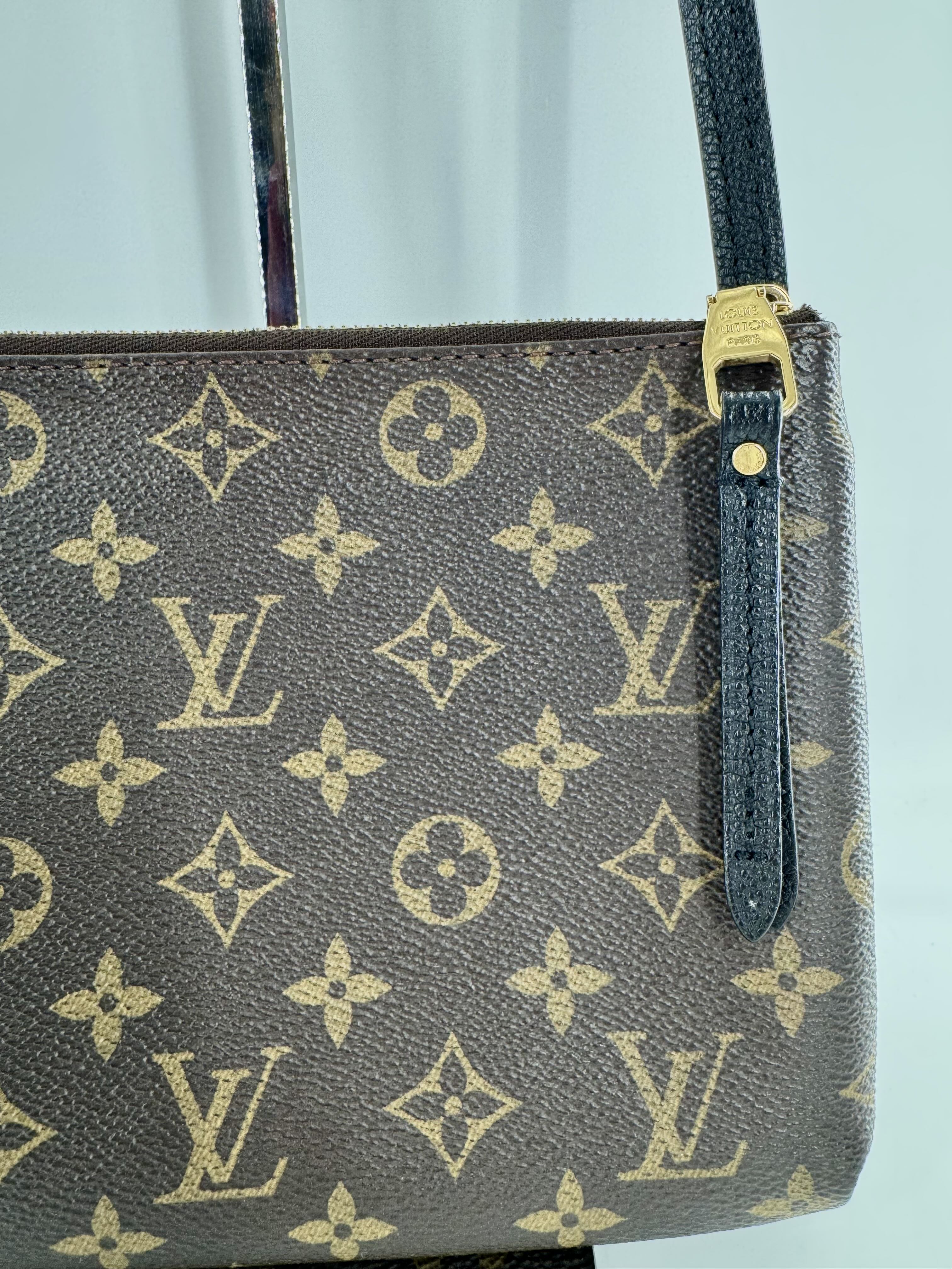 Louis Vuitton Monogram Twice crossbody w/ leather flap closure