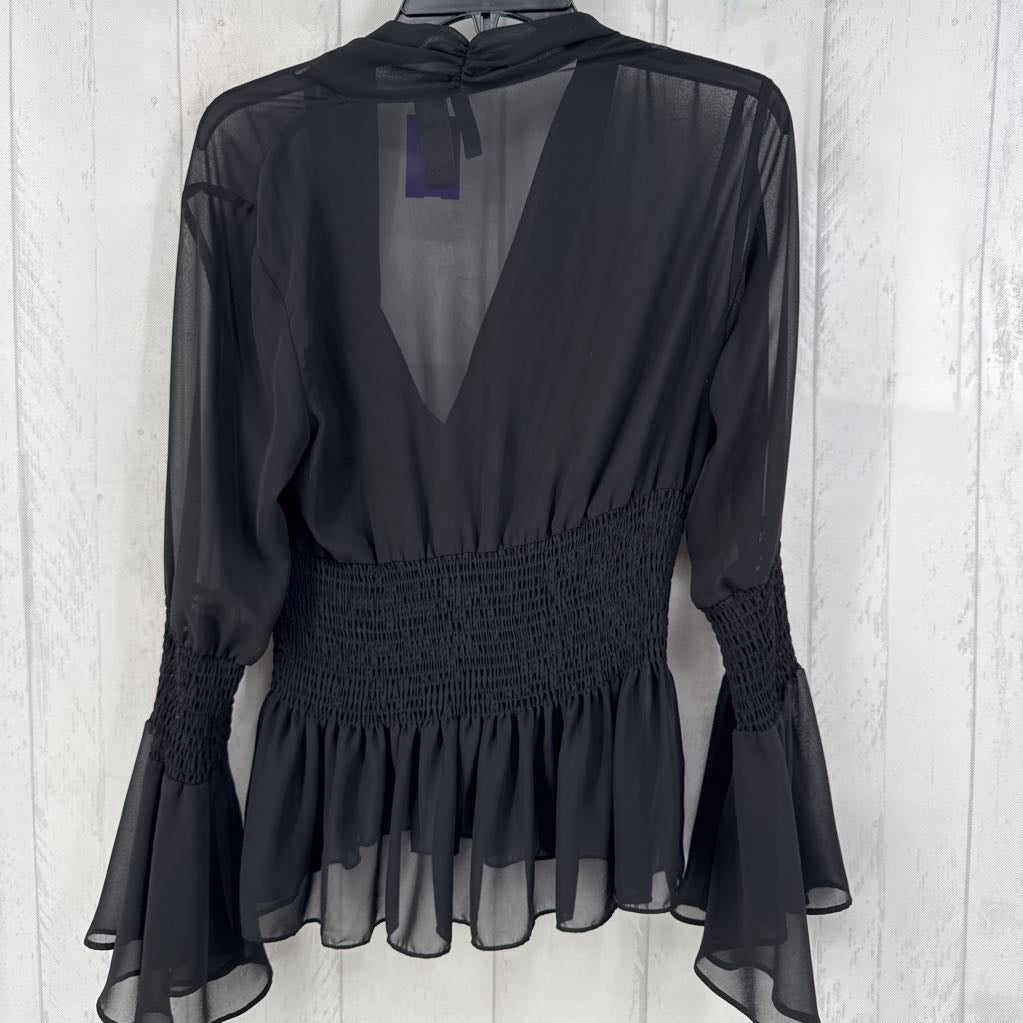10 semi sheer smocked l/s peplum top