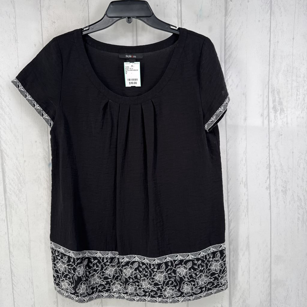 10 flo embroidered trim pleated front s/s top