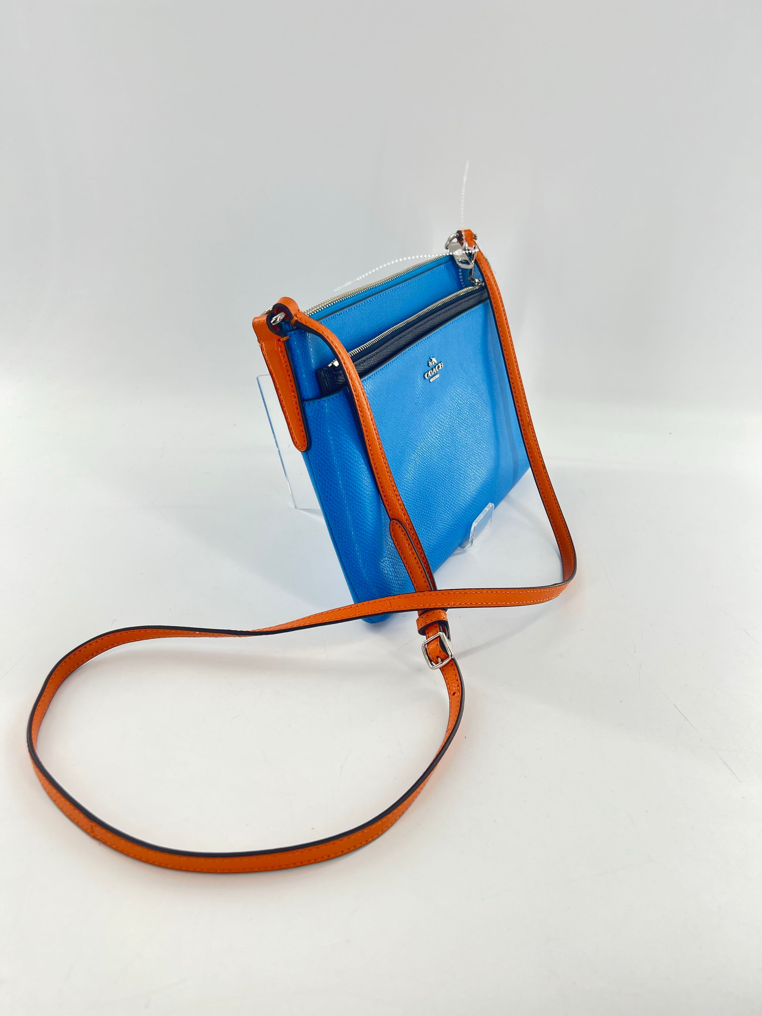 east/west crossbody w/ pop out pouch