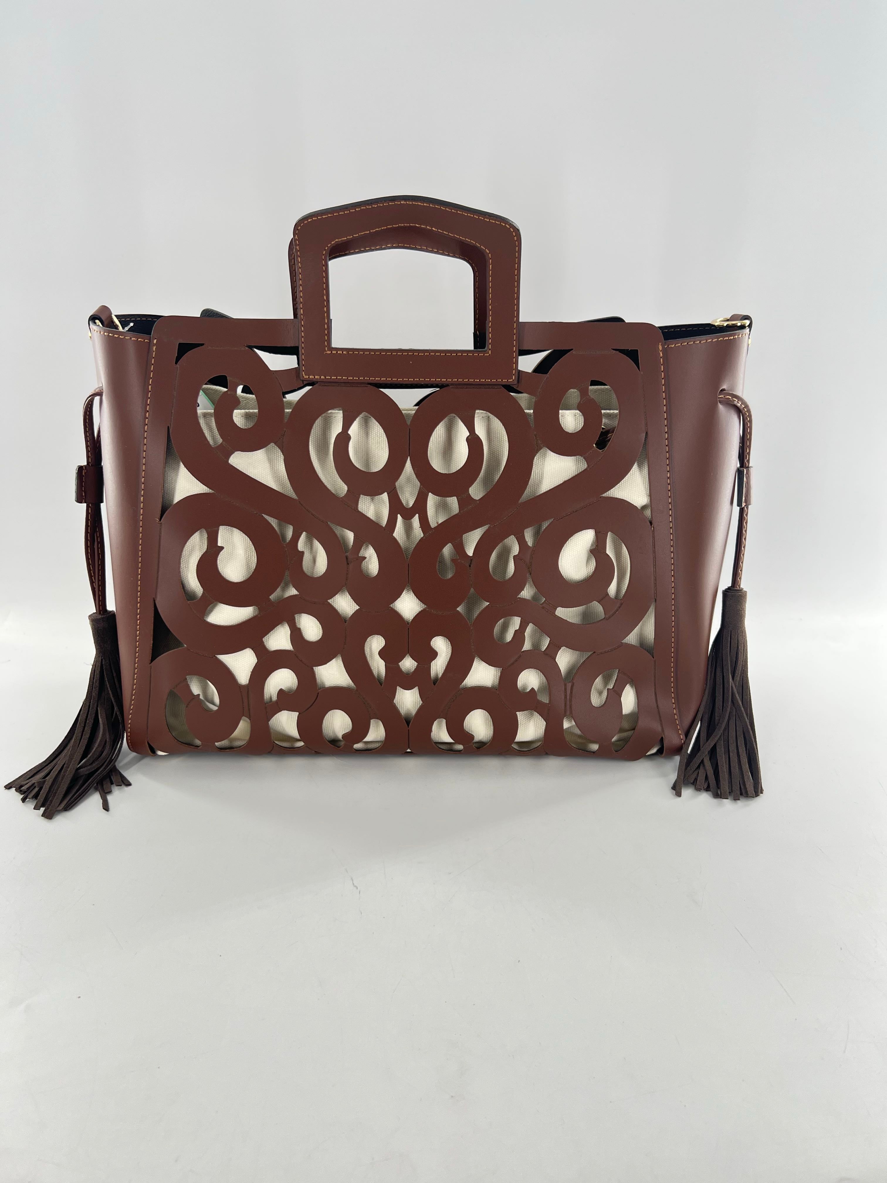 R415 leather hand-tooled musical notes tote