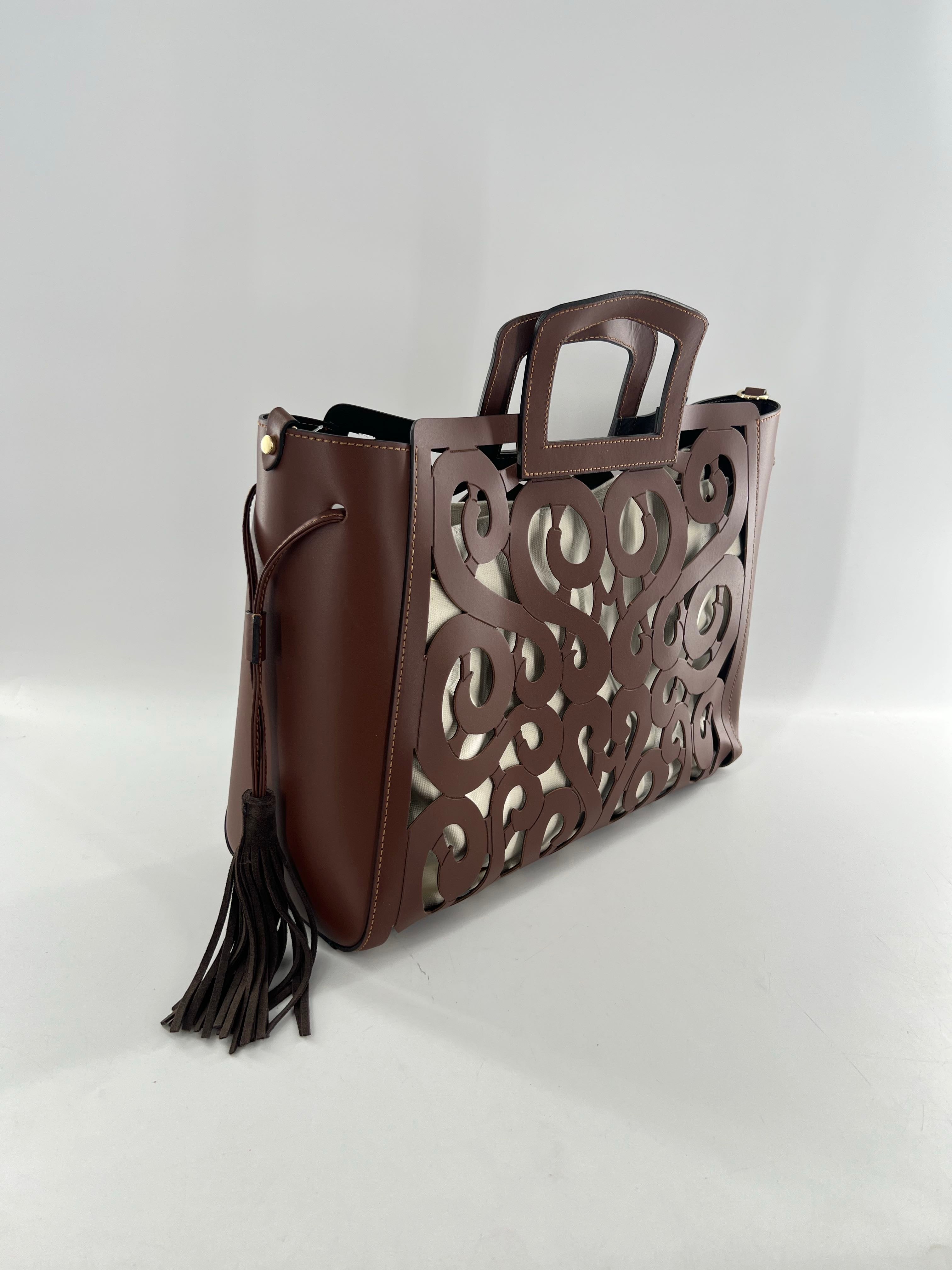 R415 leather hand-tooled musical notes tote