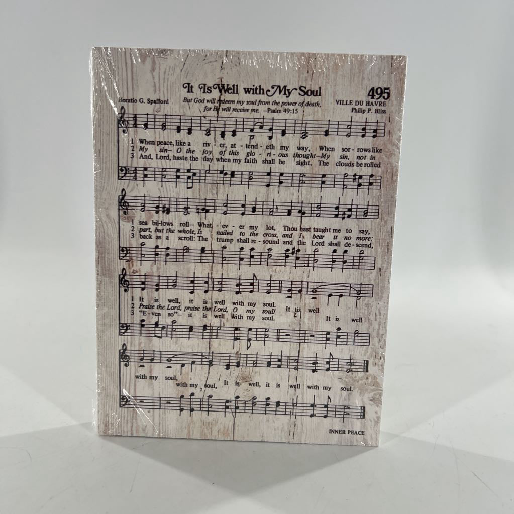 wooden sign w/ printed it is well with my soul hymn sheet musict