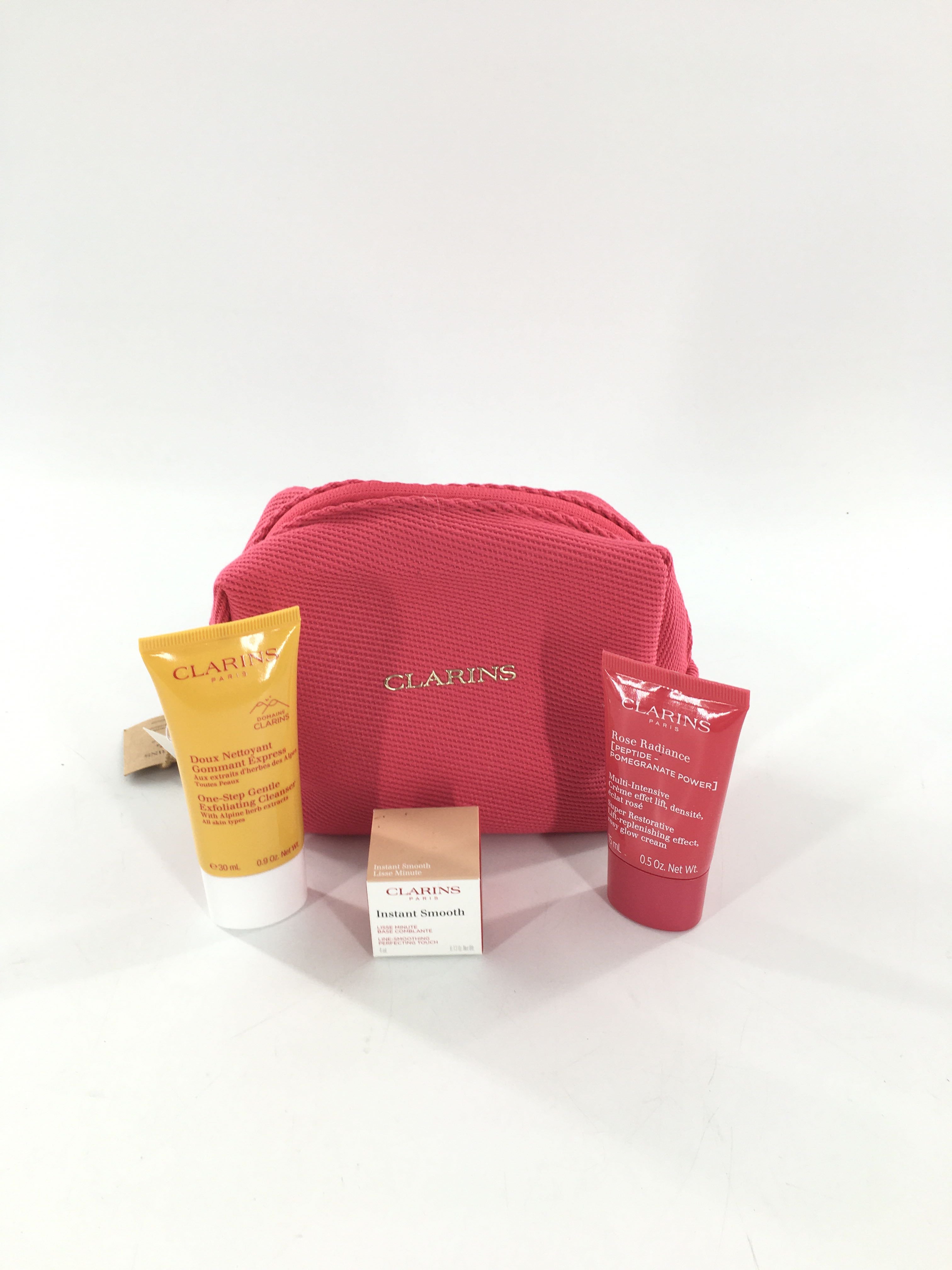 clarins giftset (pink cosmetic bag,instant smooth,cleanser,day cream,rosy glow)