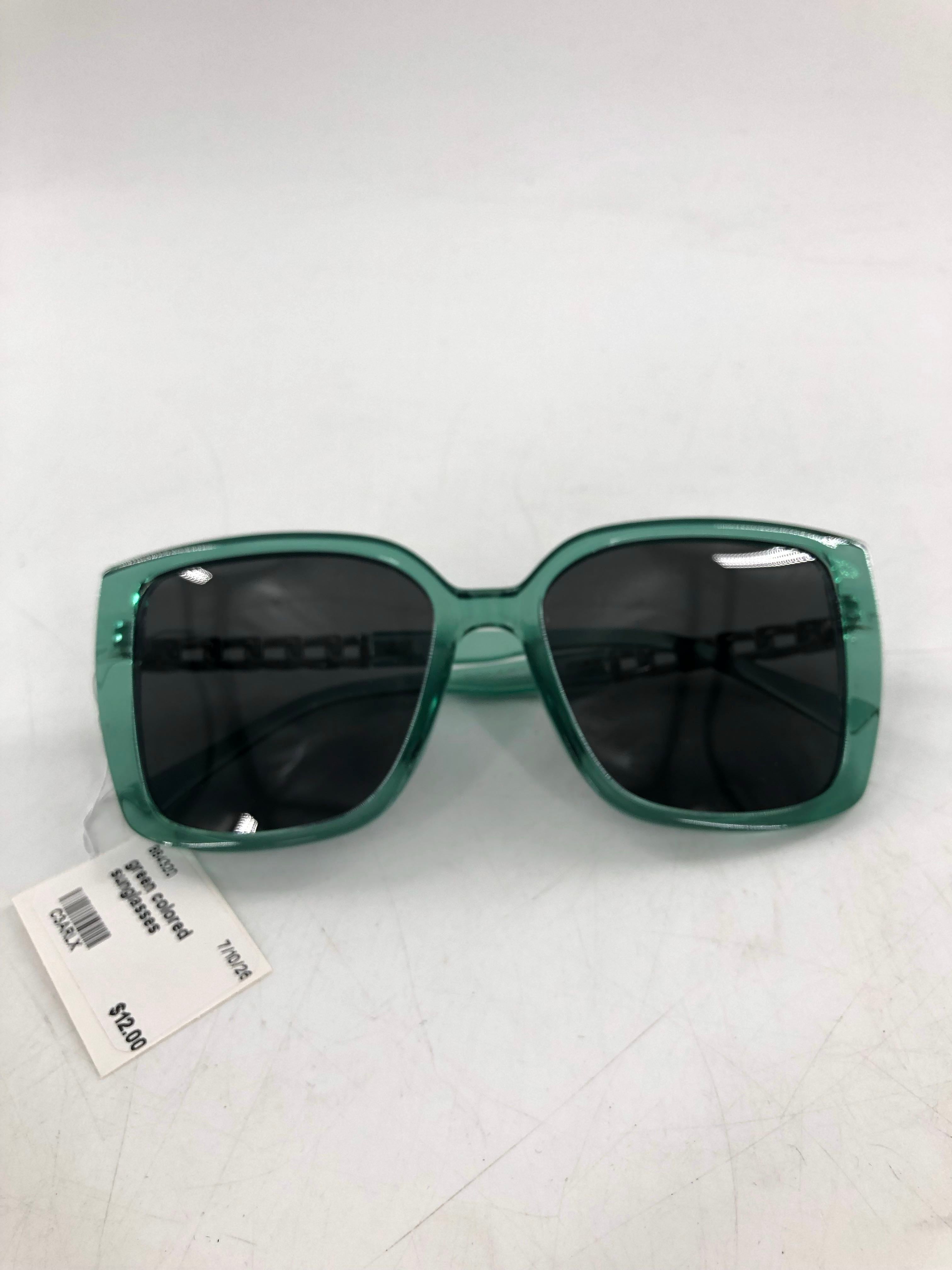 green colored sunglasses