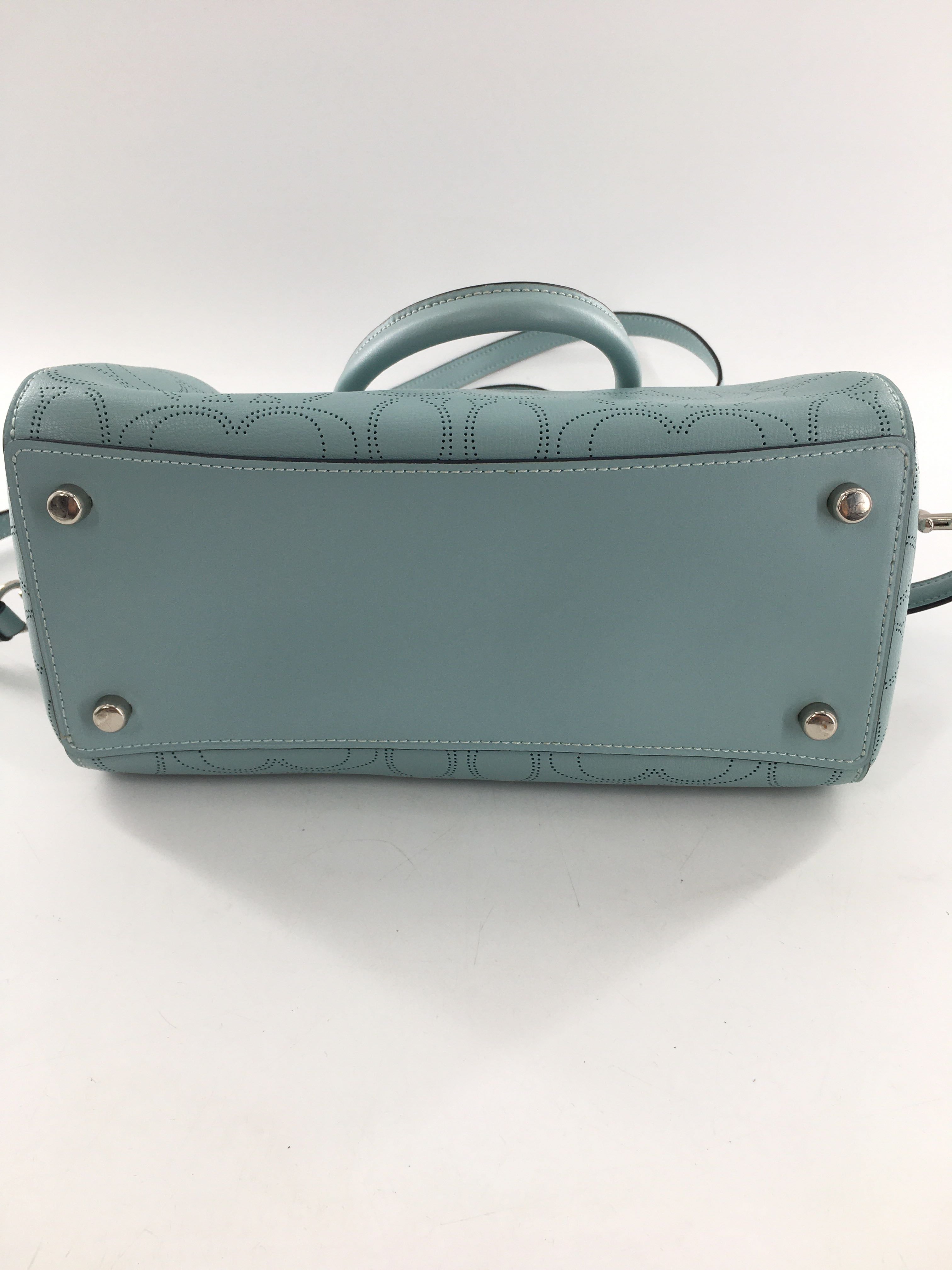 perforated signature pattern satchel