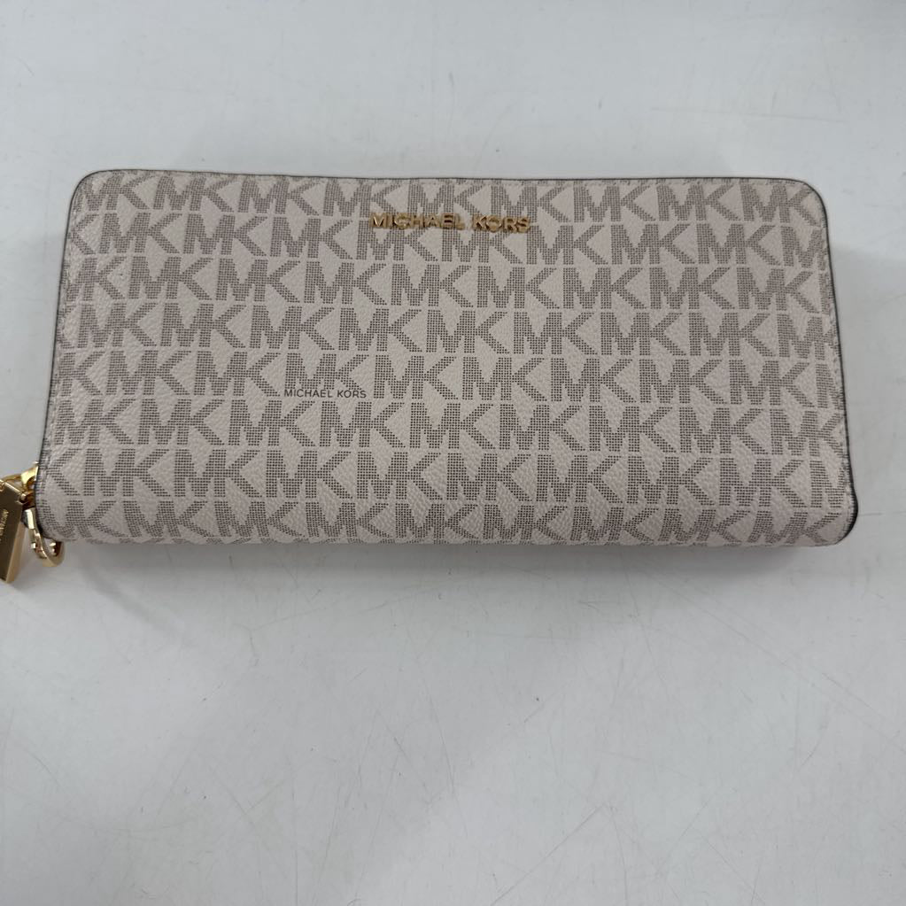 zip around monogram wallet