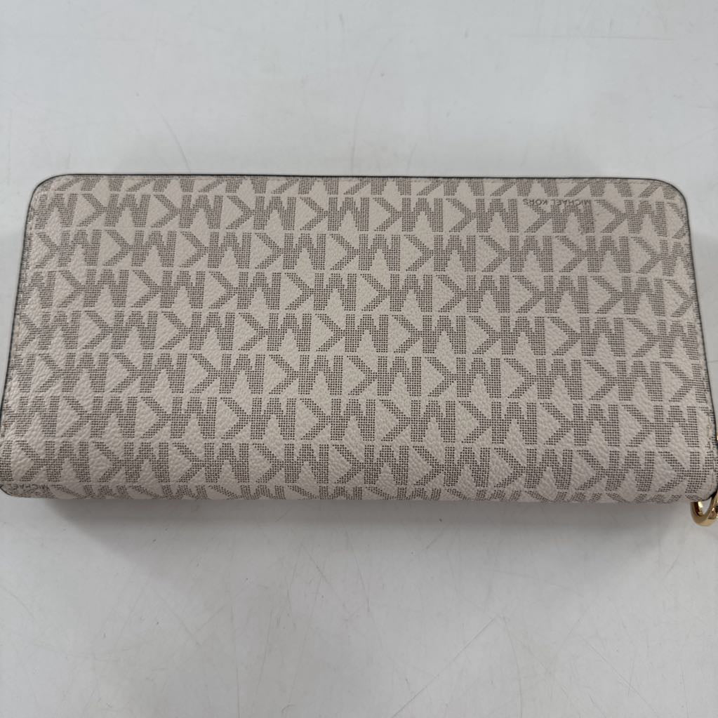 zip around monogram wallet
