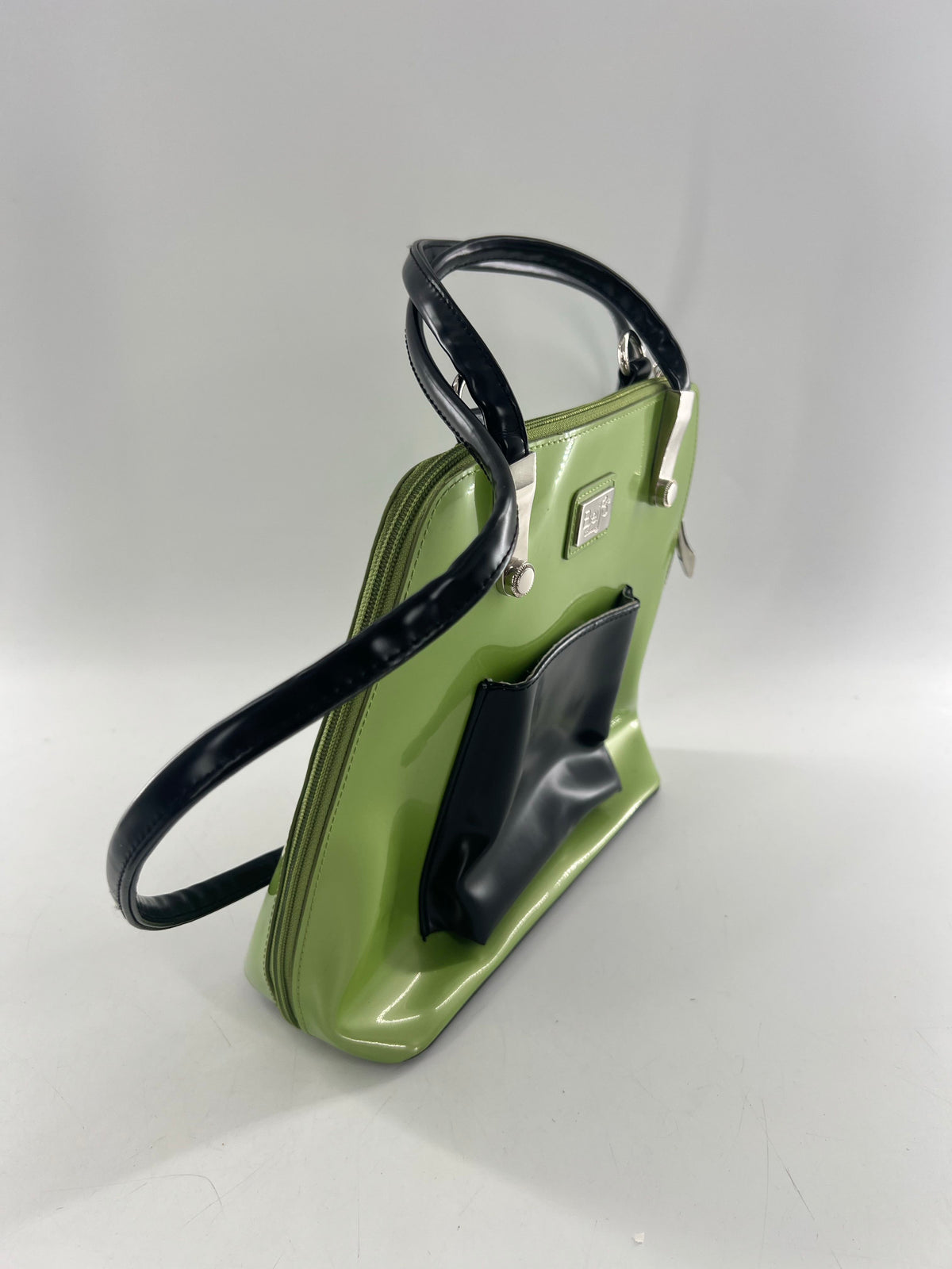 patent zip around shoulder bag w/ prominent front pocket