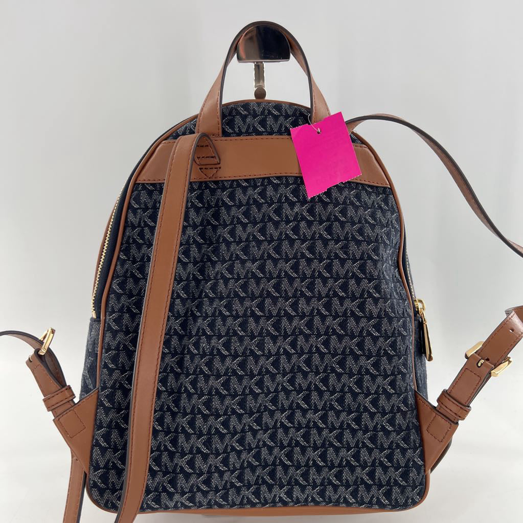 R328 monogram jacquard dernim & leather backpack