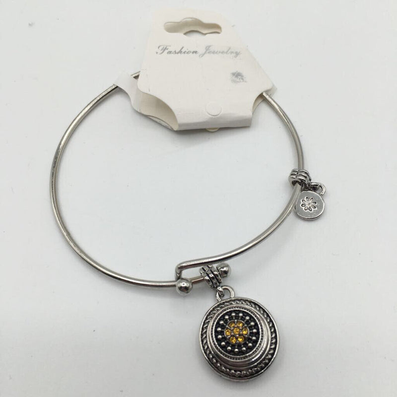 silvertone bracelet with yellow charm