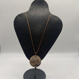 beige corded necklace w/round wooden pendant