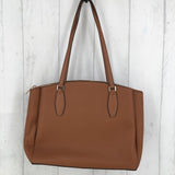 Pebbled leather triple compartment handbag