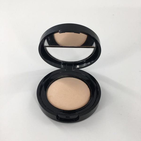 0.14 oz Laura Geller baked blurring+setting powder porcelain/fair