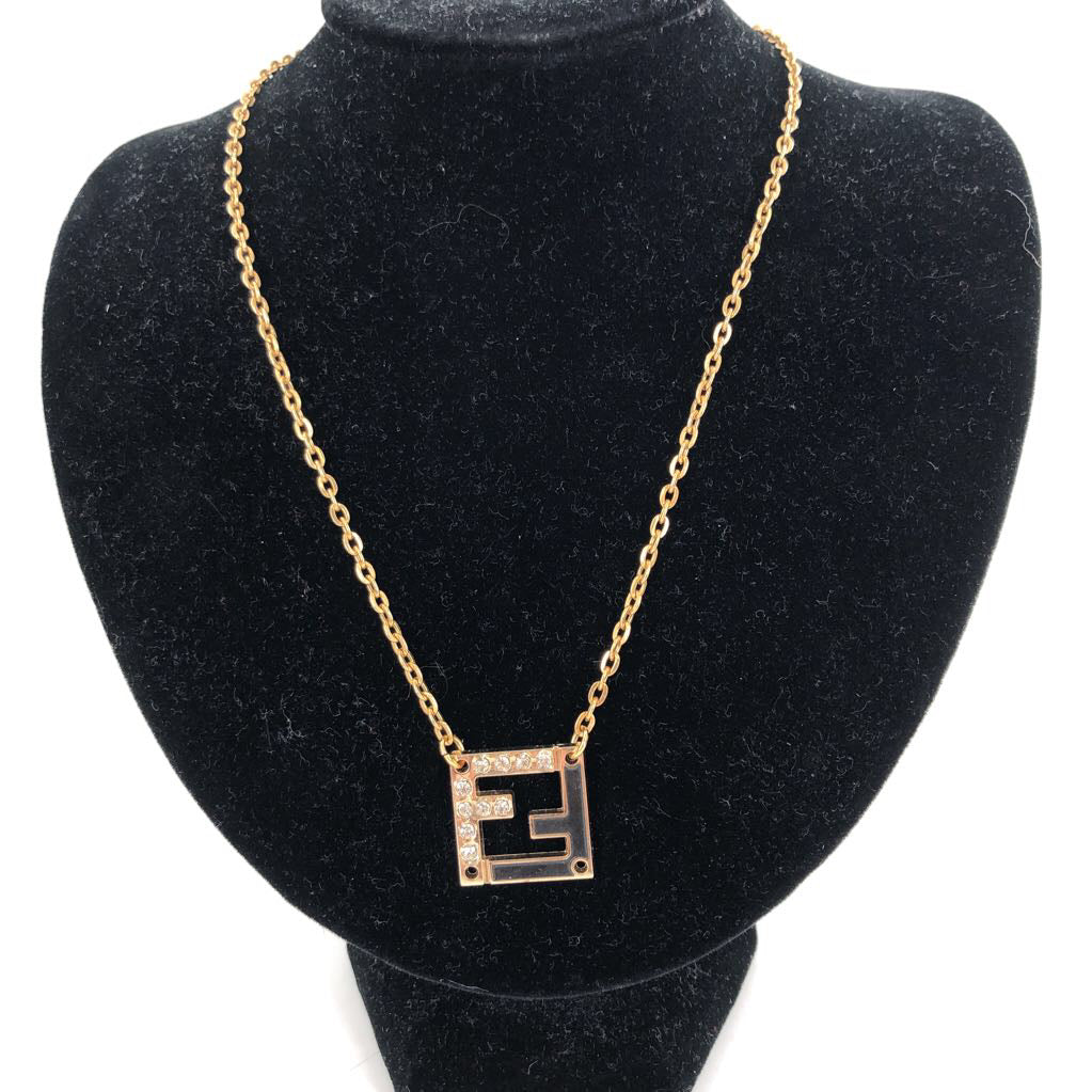 9" Goldtone & black pendant necklace
