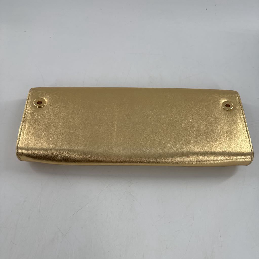 gold leather grommet clutch