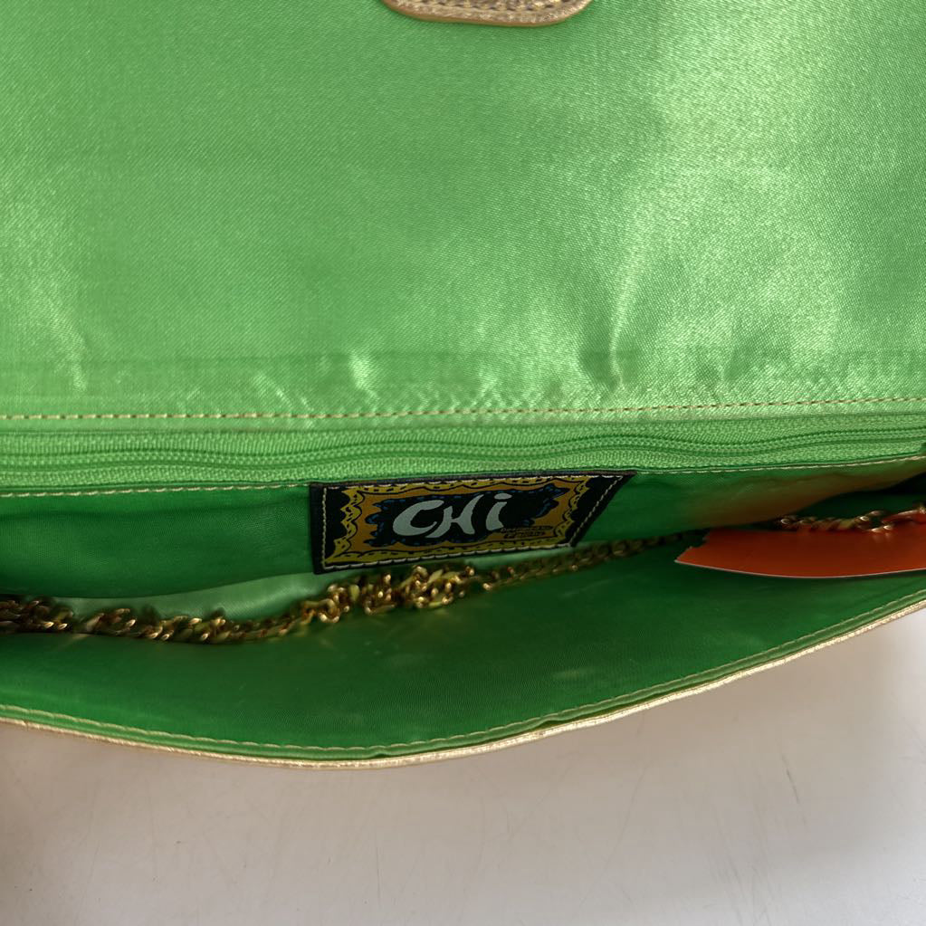 gold leather grommet clutch