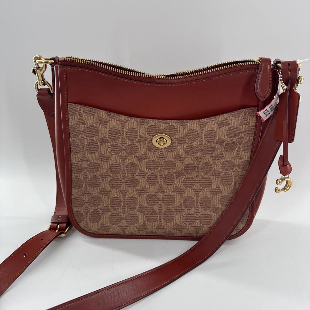 signature turnlock top zip crossbody