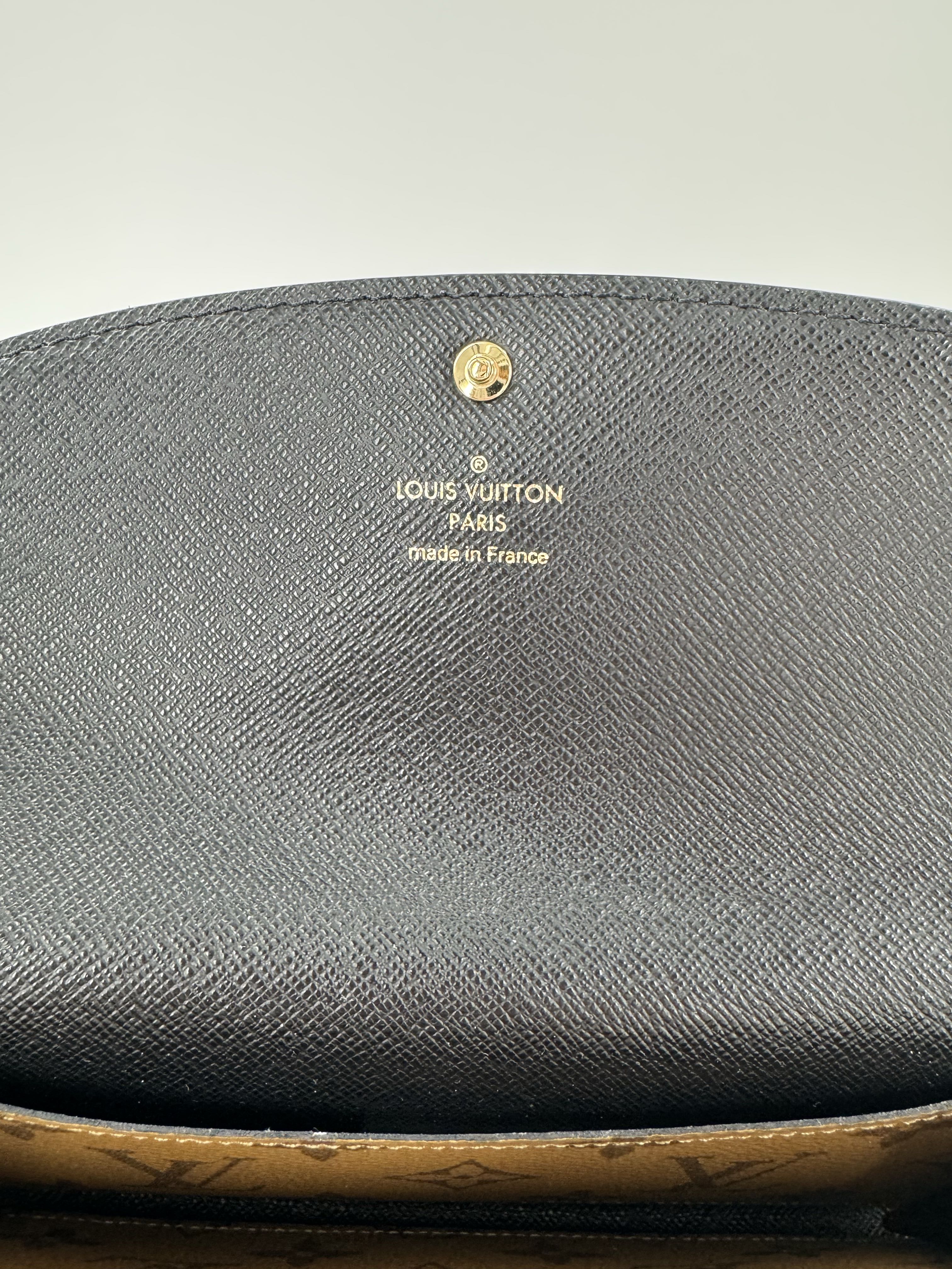 Reverse monogram bi-fold wallet