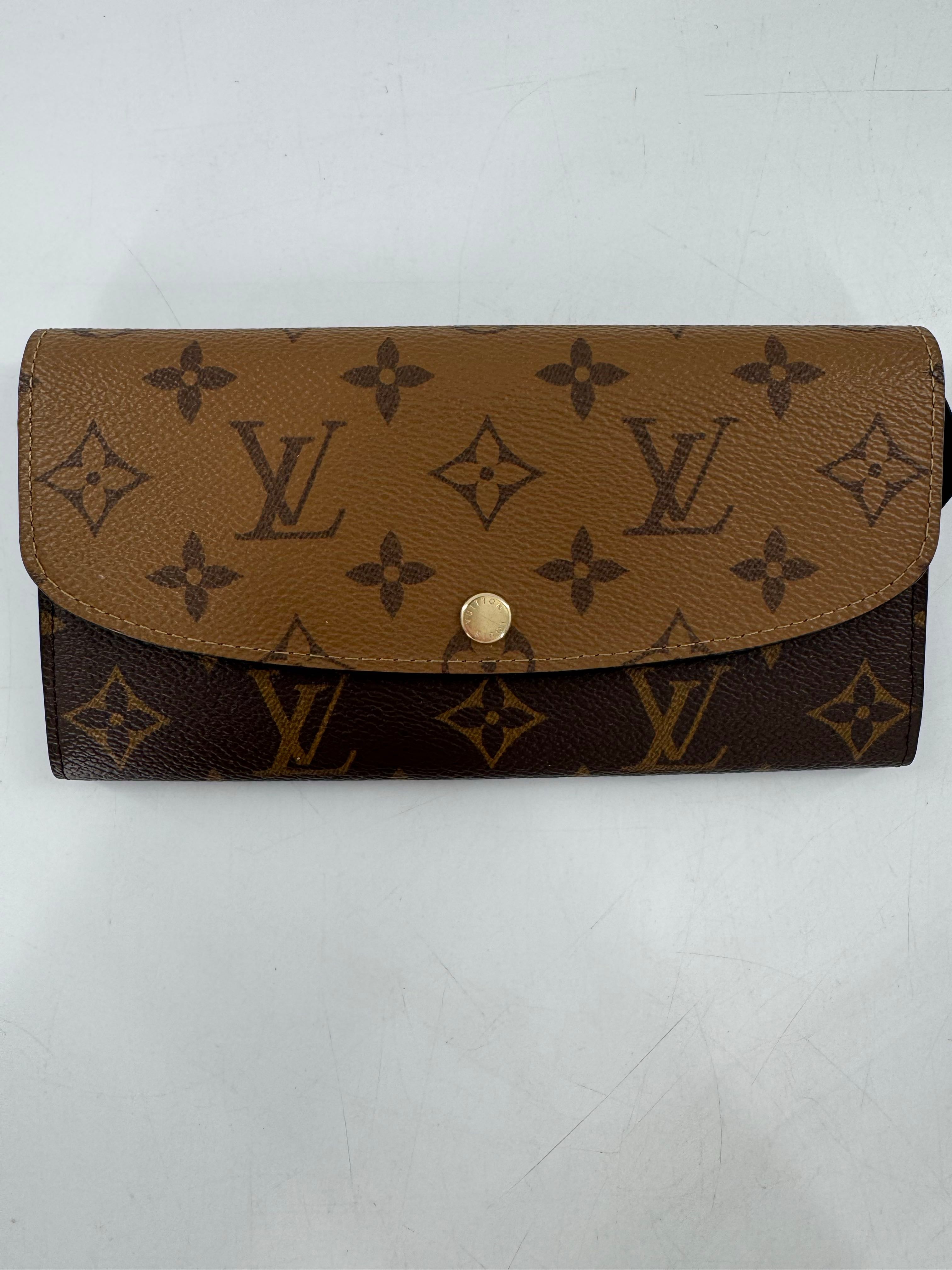 Reverse monogram bi-fold wallet