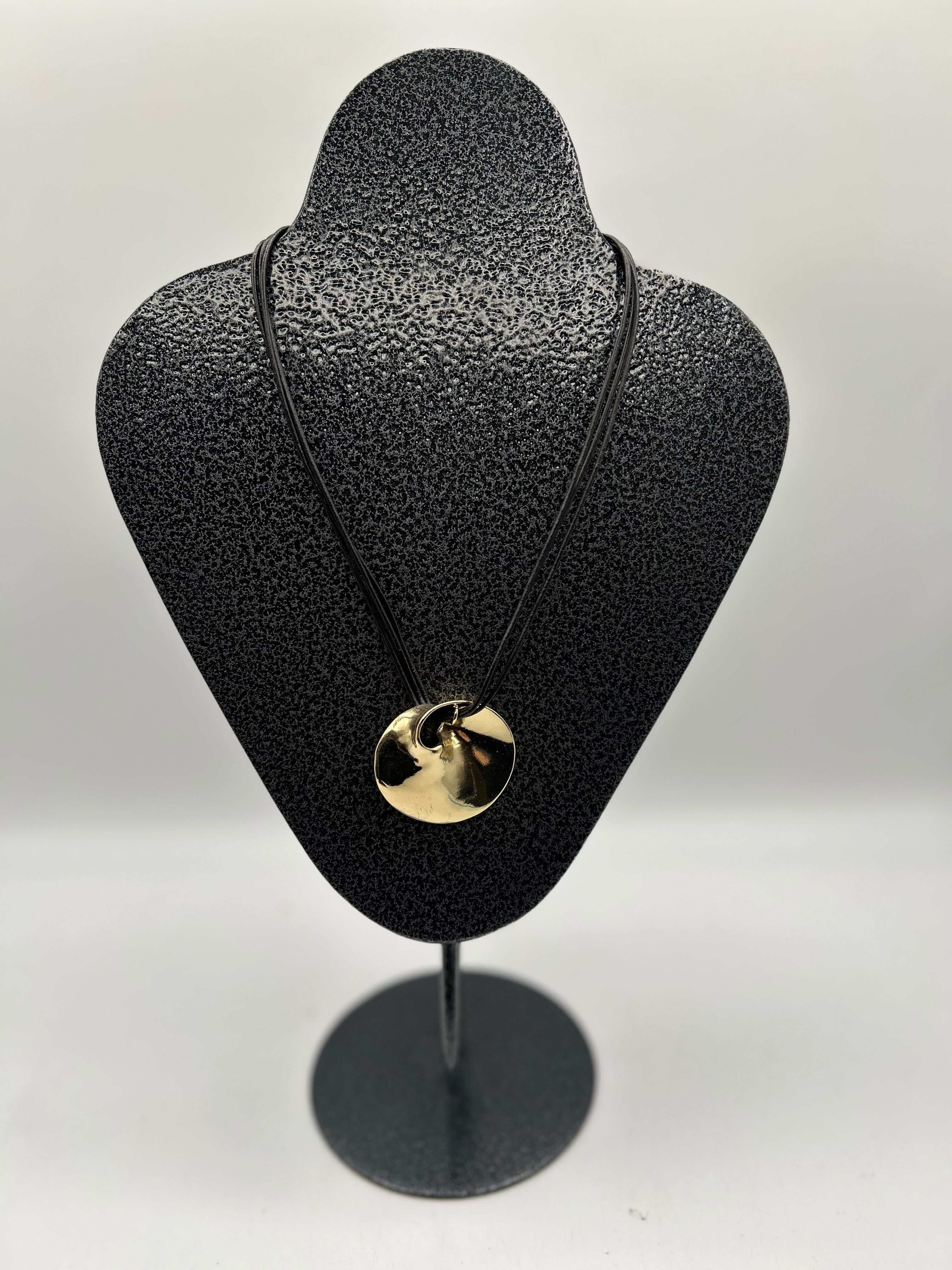 brown leather necklace w/ gold pendant