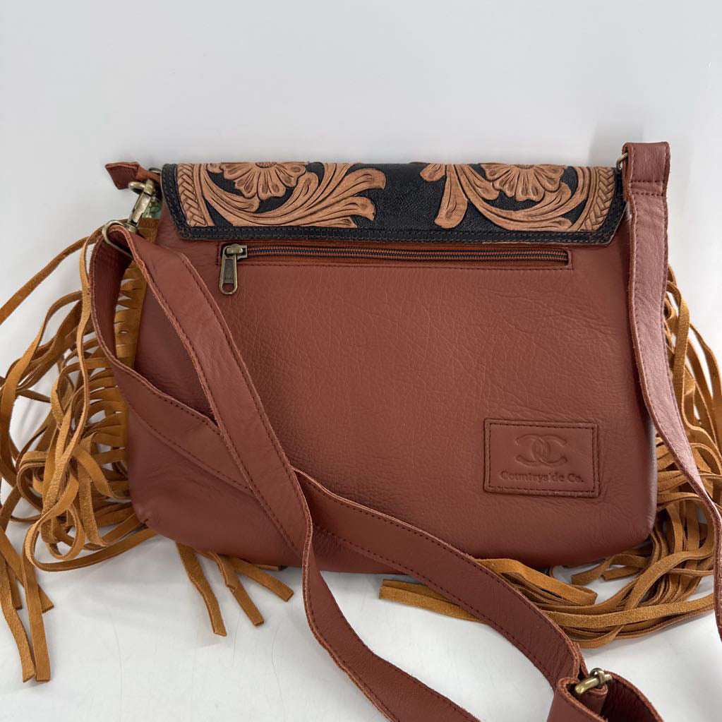 R90 tooled cowhide fringe crossbody