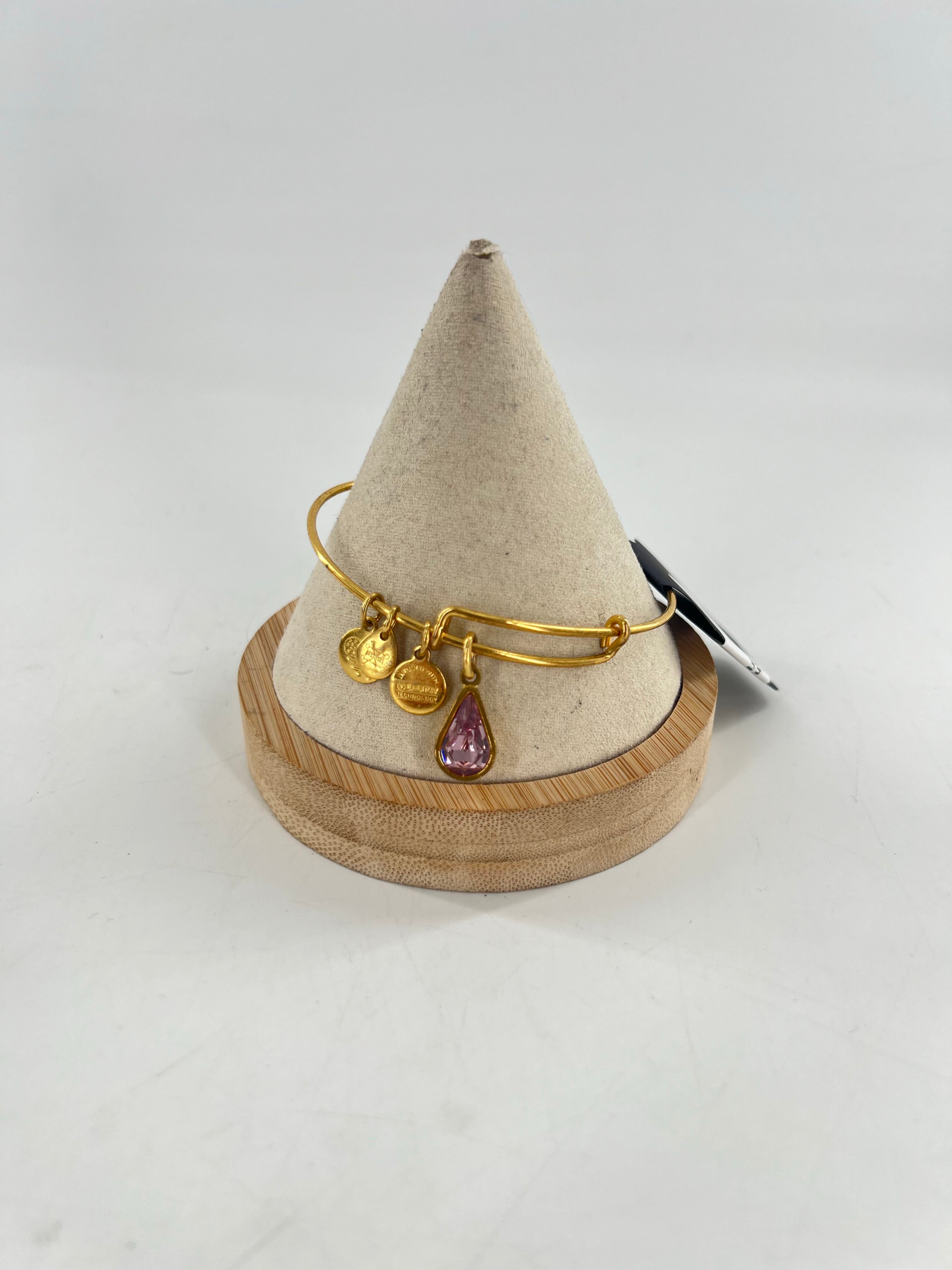 gold tone charm bracelet-purple stone charm