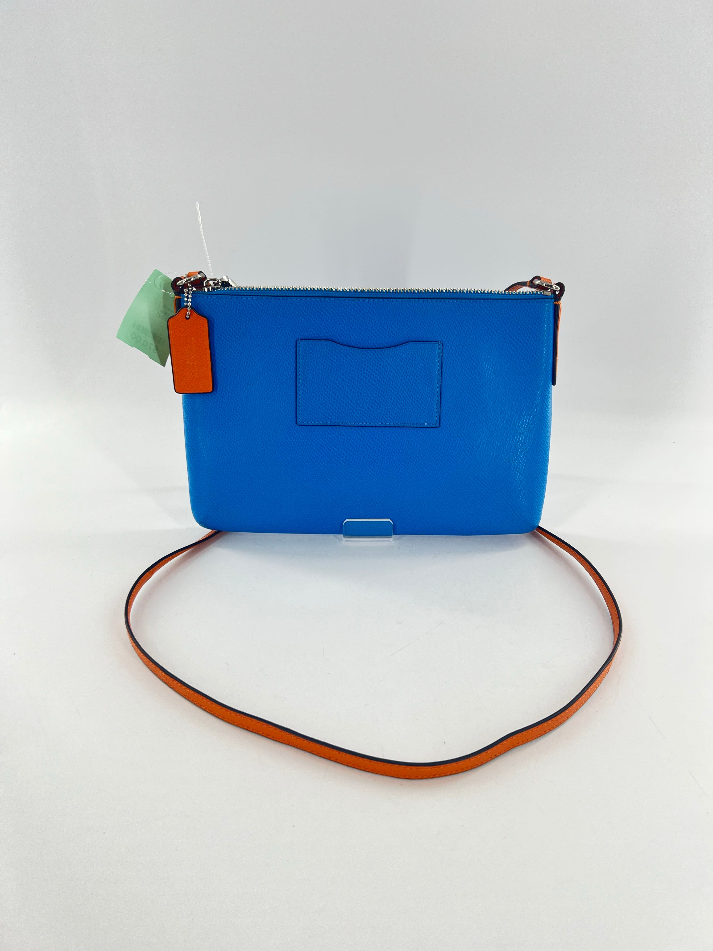 east/west crossbody w/ pop out pouch