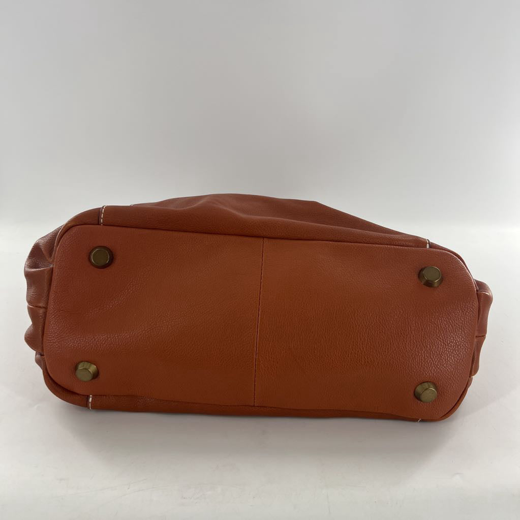 footed magnetic closure shoulder bag
