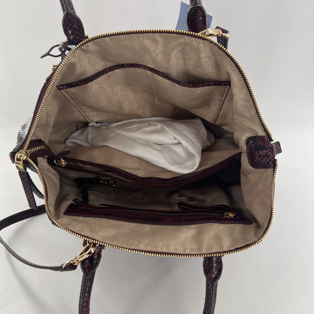 snakeskin embossed side panels and handles satchel
