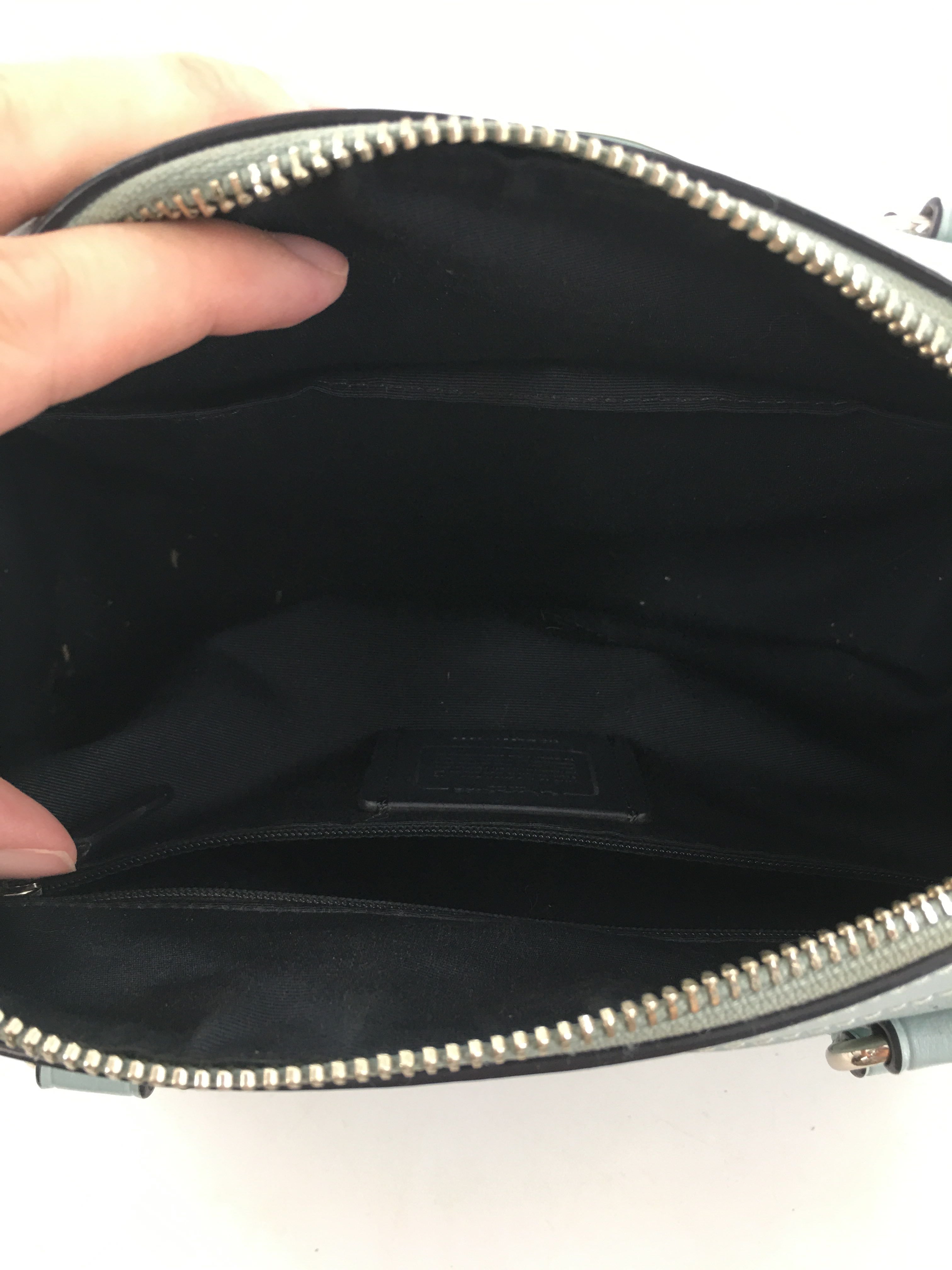 perforated signature pattern satchel