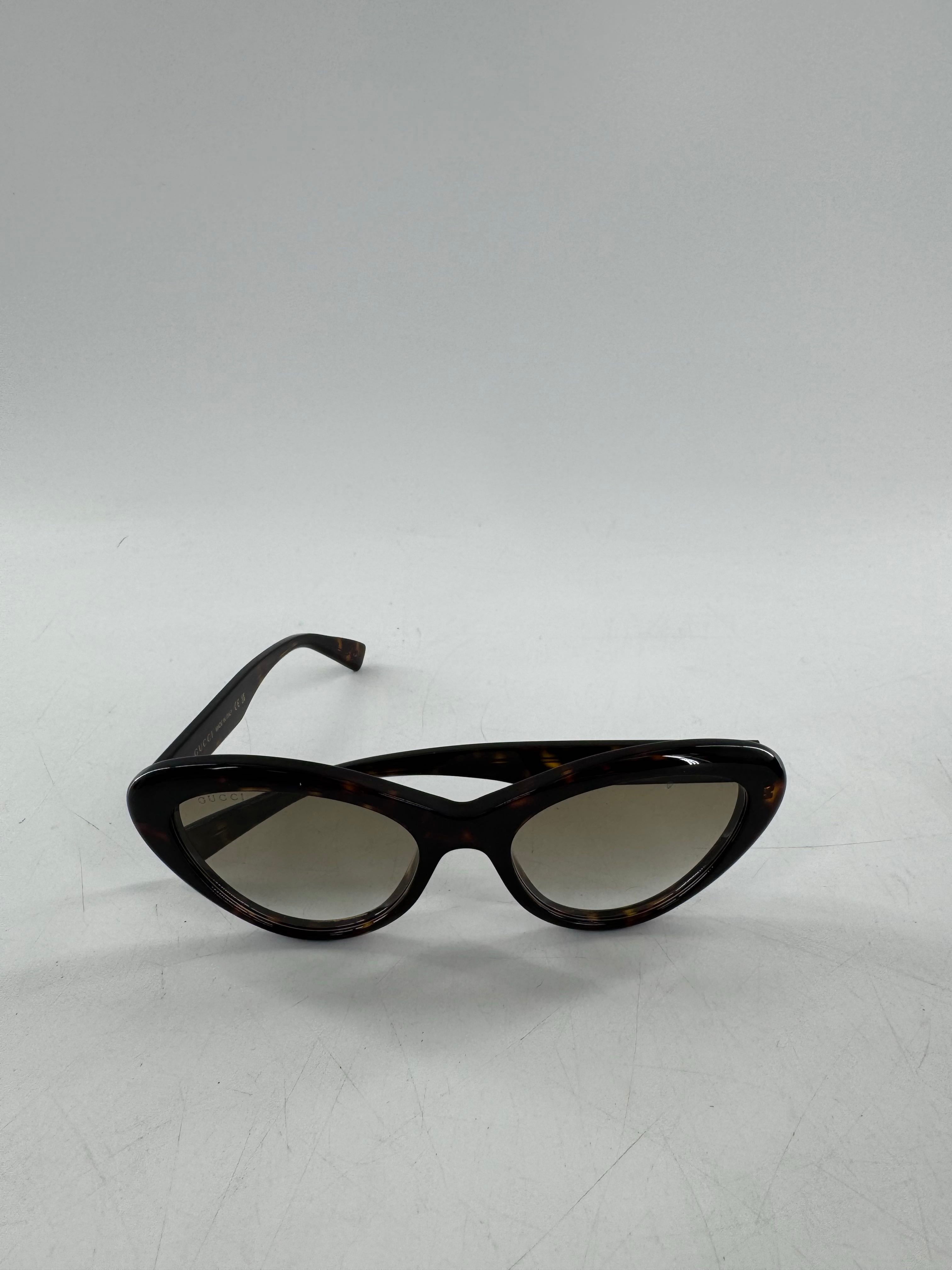 Gucci tortoiseshell cat-eye sunglasses w/ case