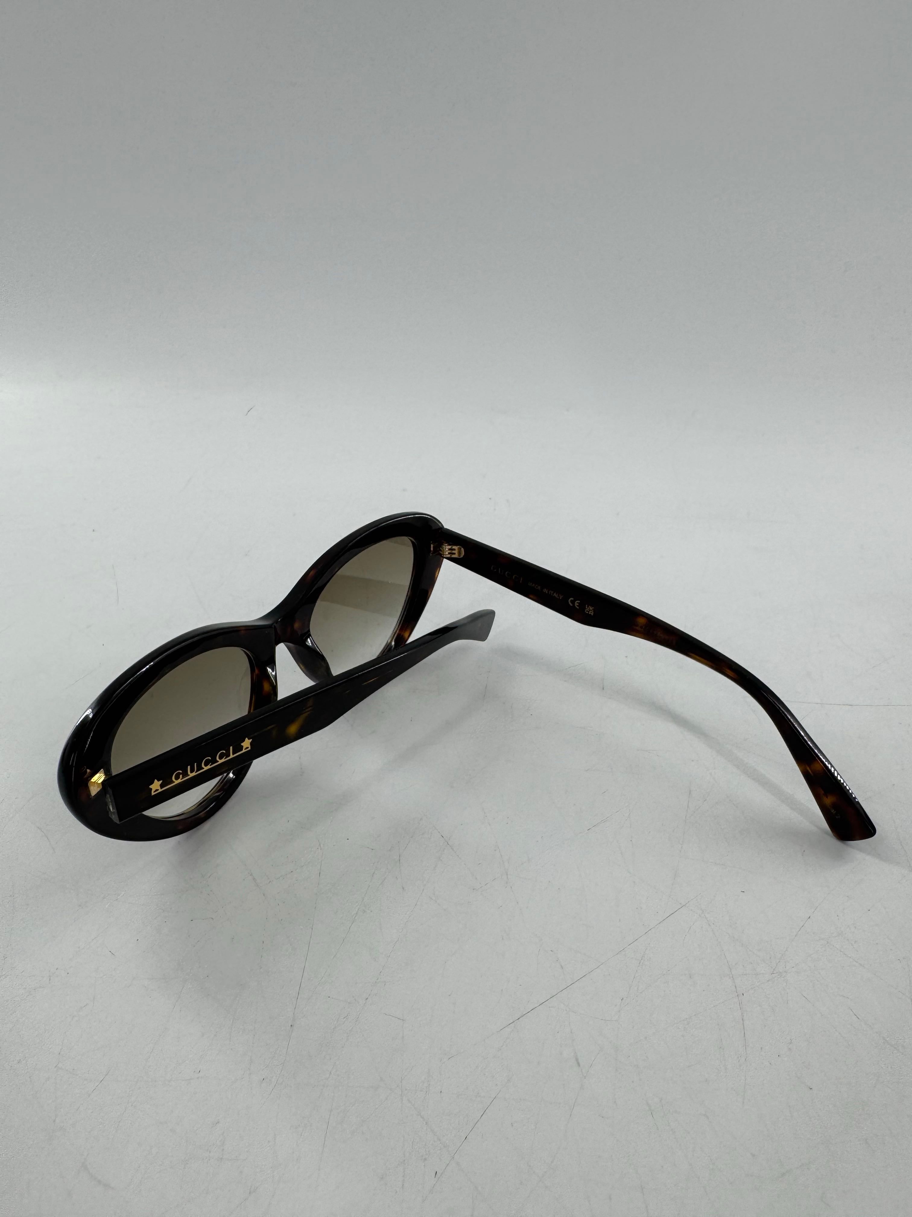 Gucci tortoiseshell cat-eye sunglasses w/ case