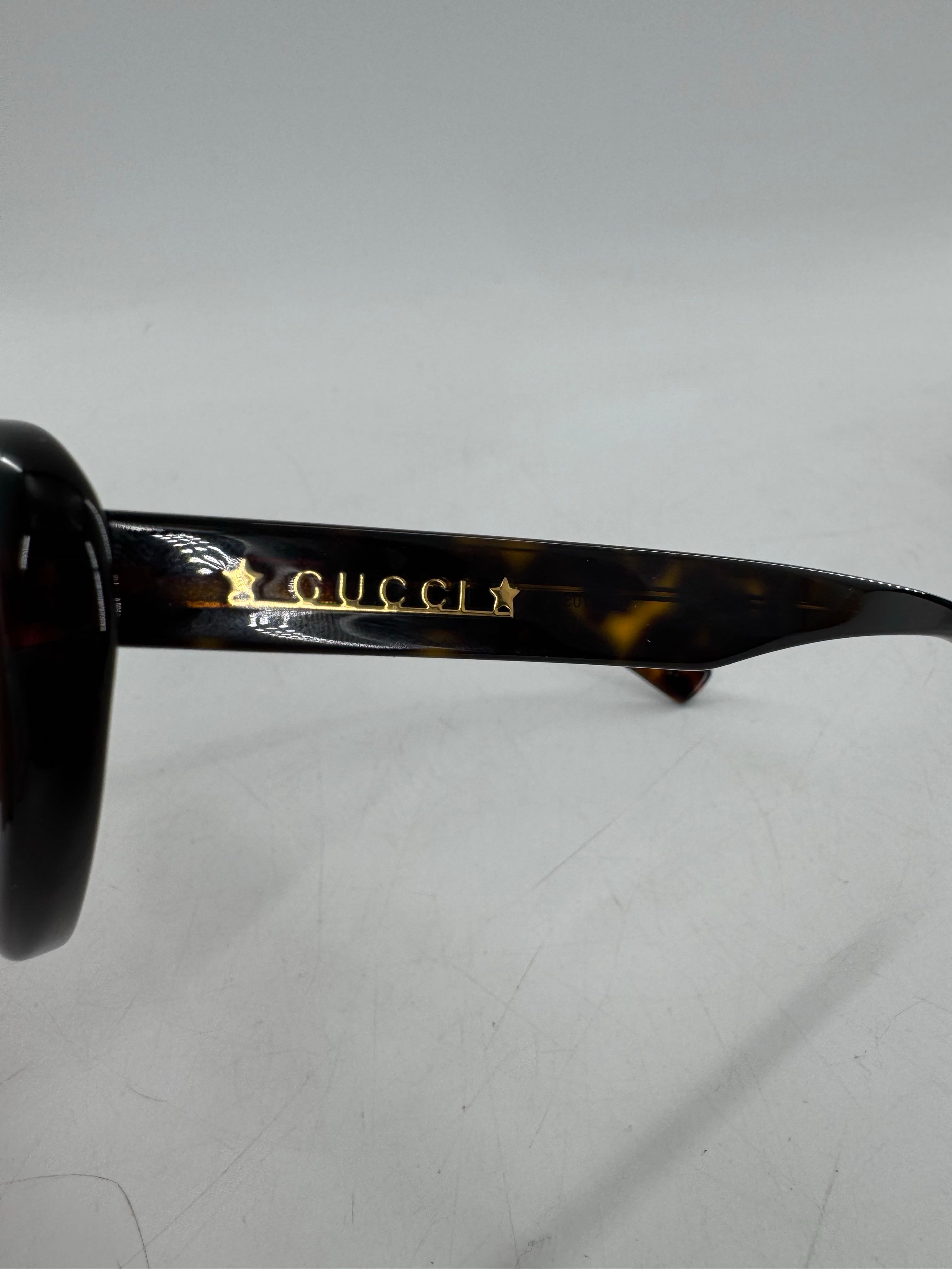 Gucci tortoiseshell cat-eye sunglasses w/ case