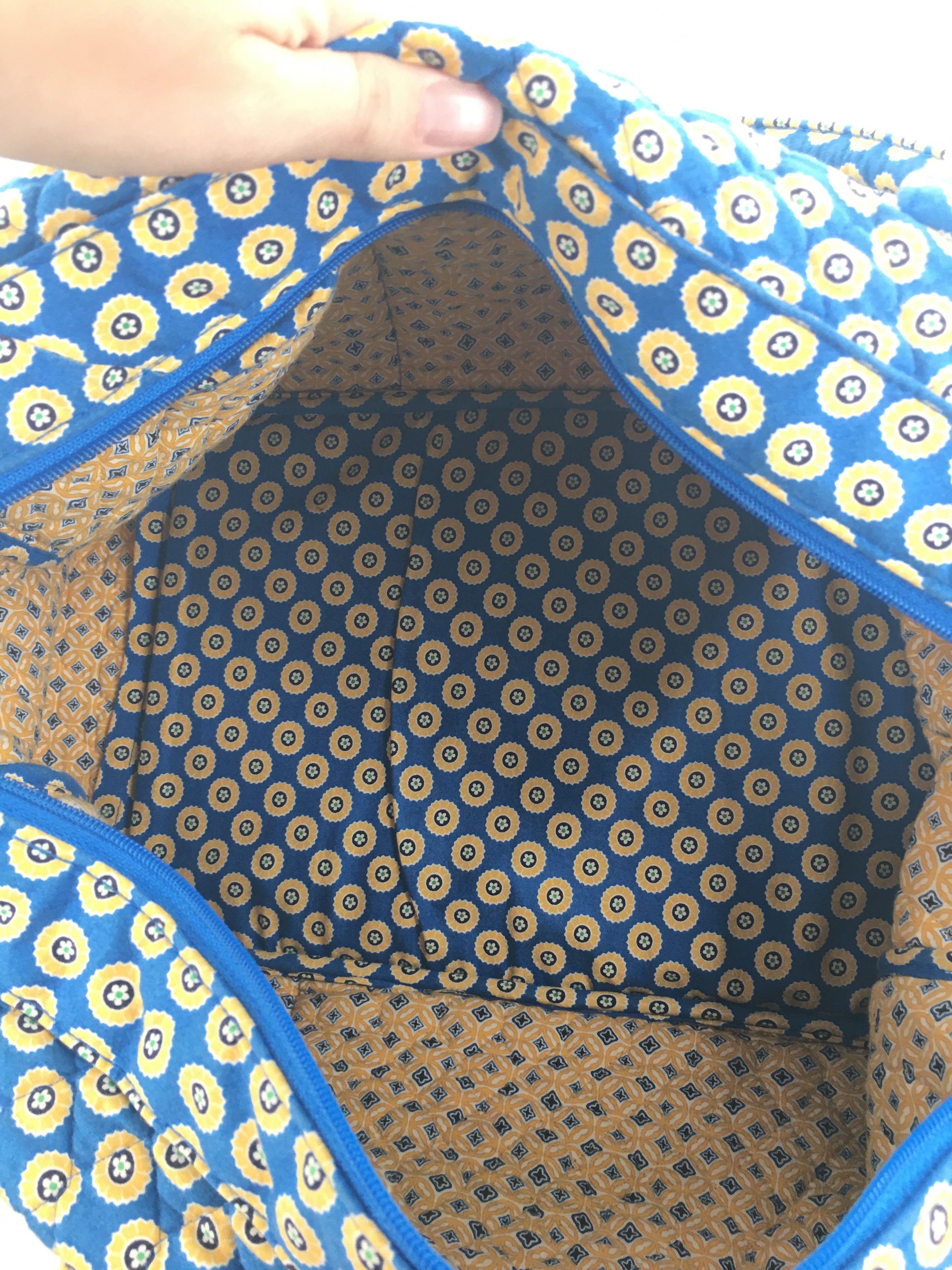 quilted circular floral design overnight bag