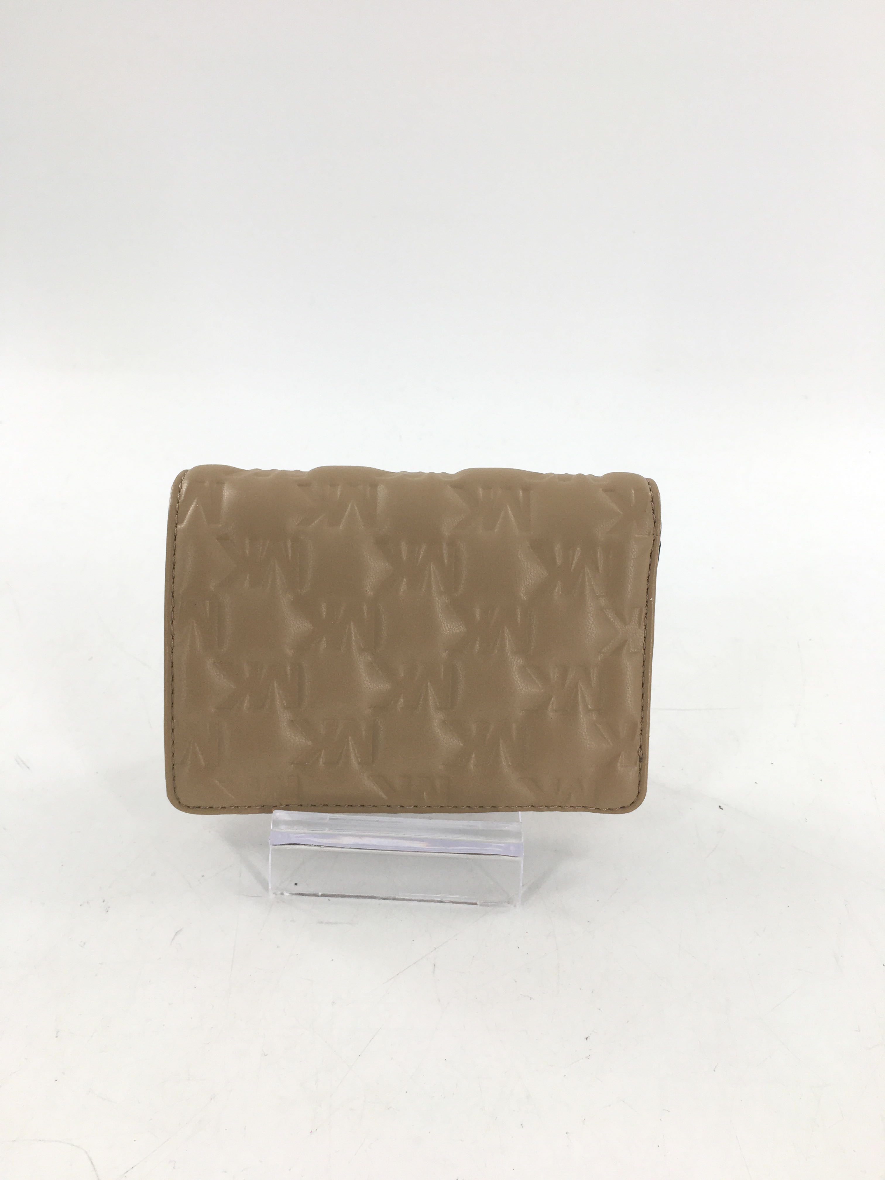 debossed puffy monogram bifold wallet