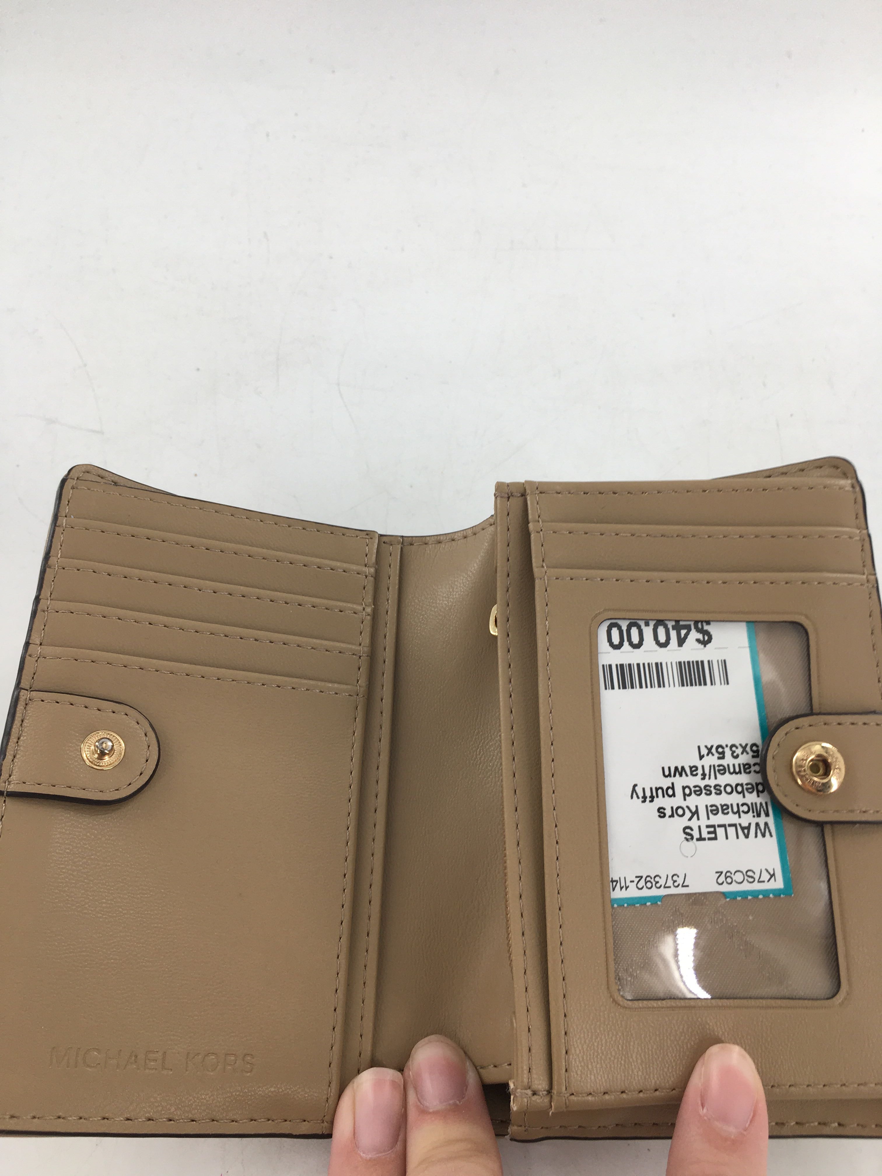 debossed puffy monogram bifold wallet