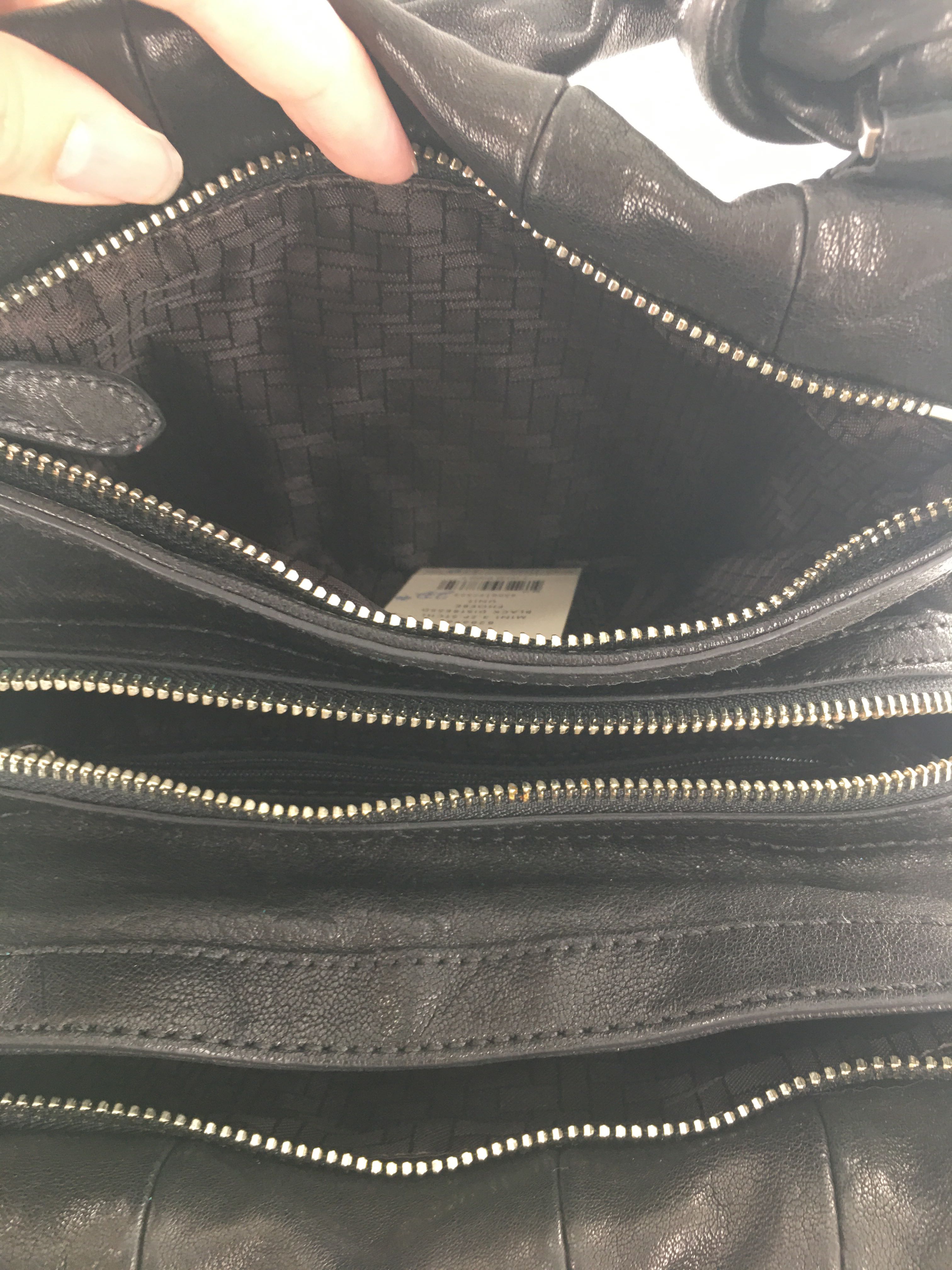 R232 leather tassel handbag