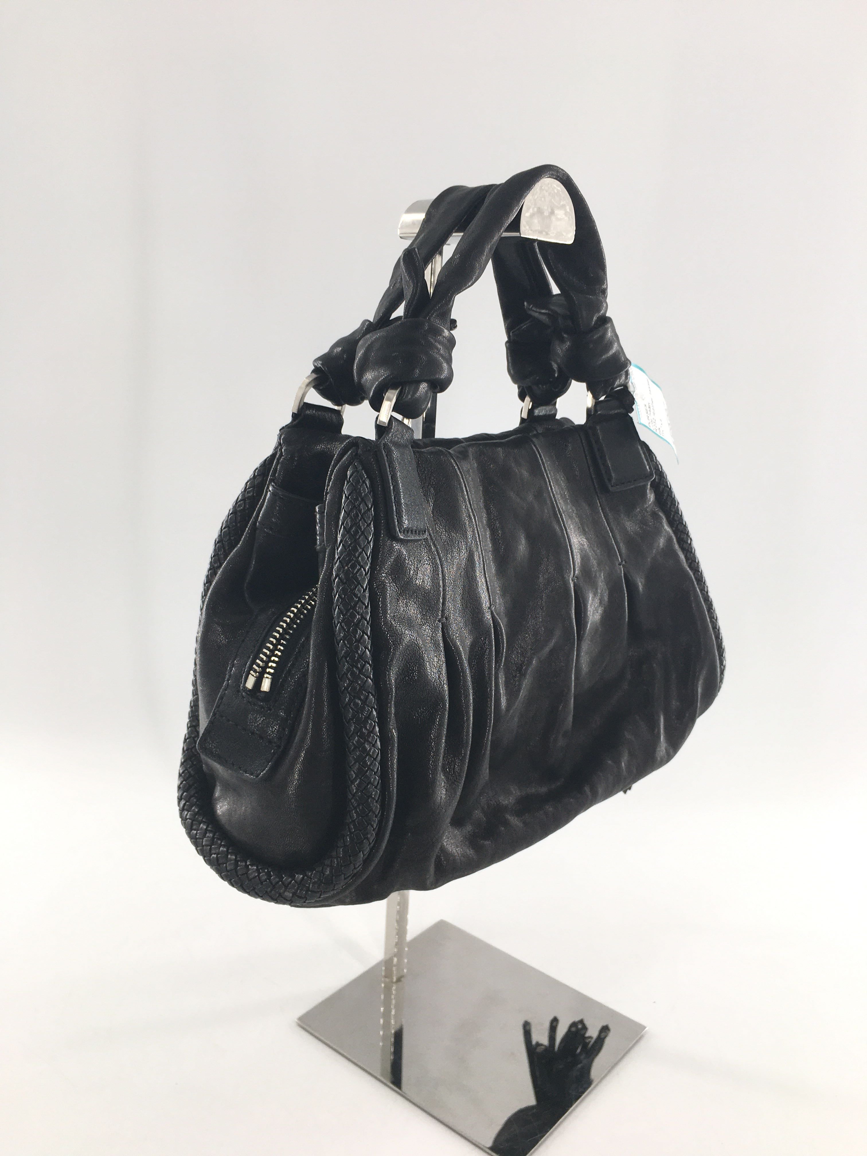 R232 leather tassel handbag