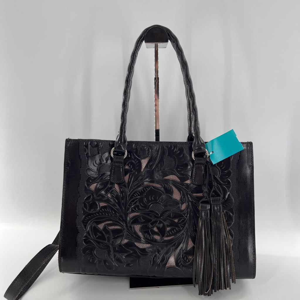 flo embossed tassel handbag