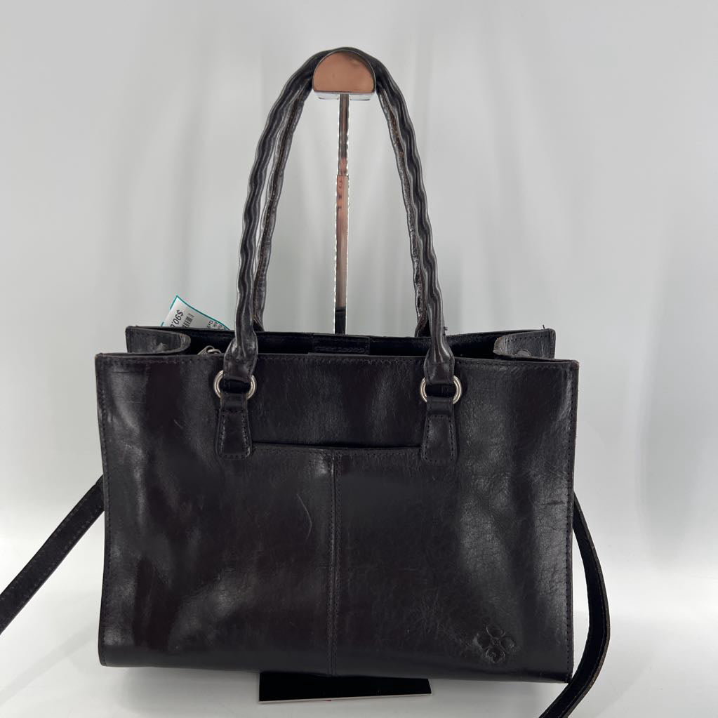 flo embossed tassel handbag