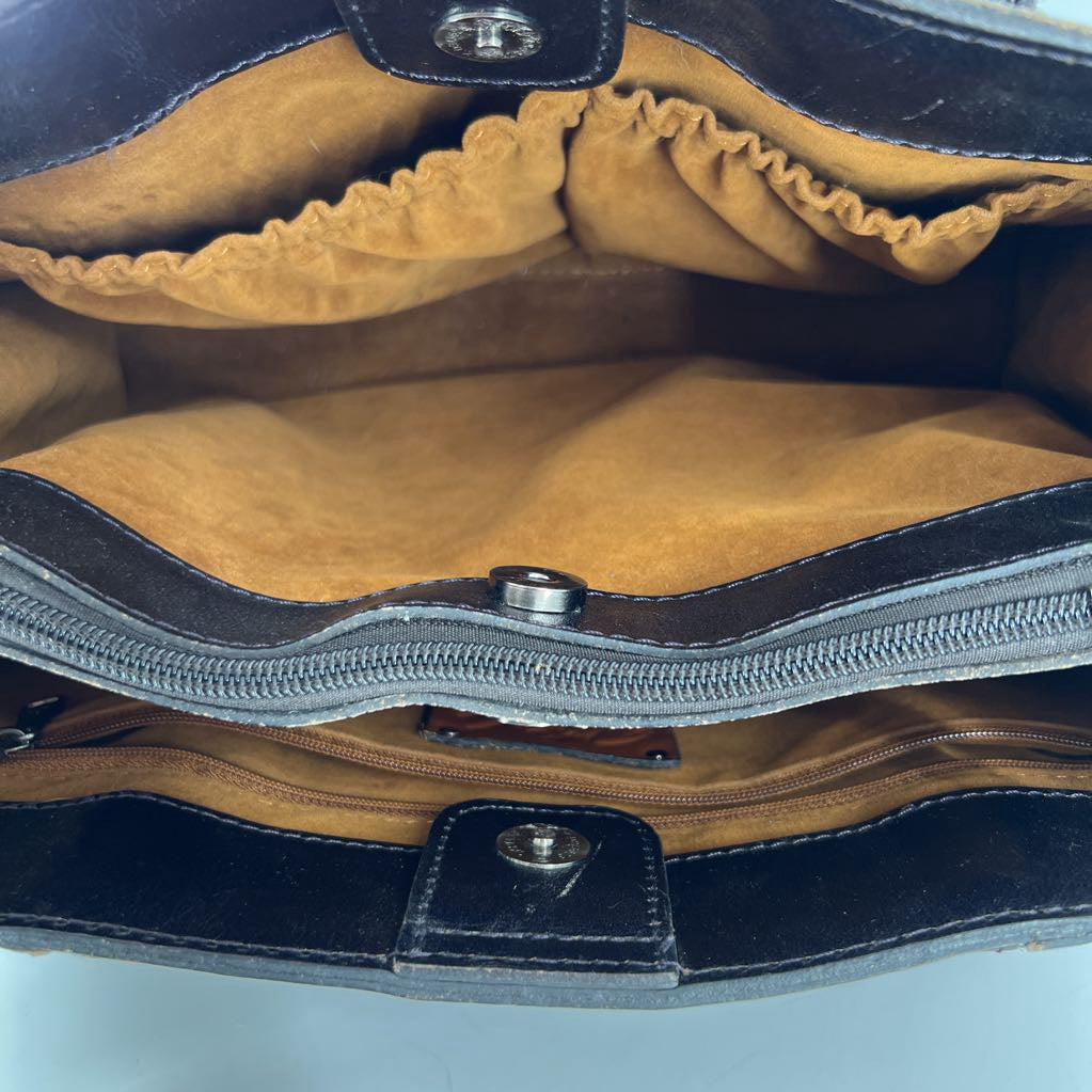 flo embossed tassel handbag
