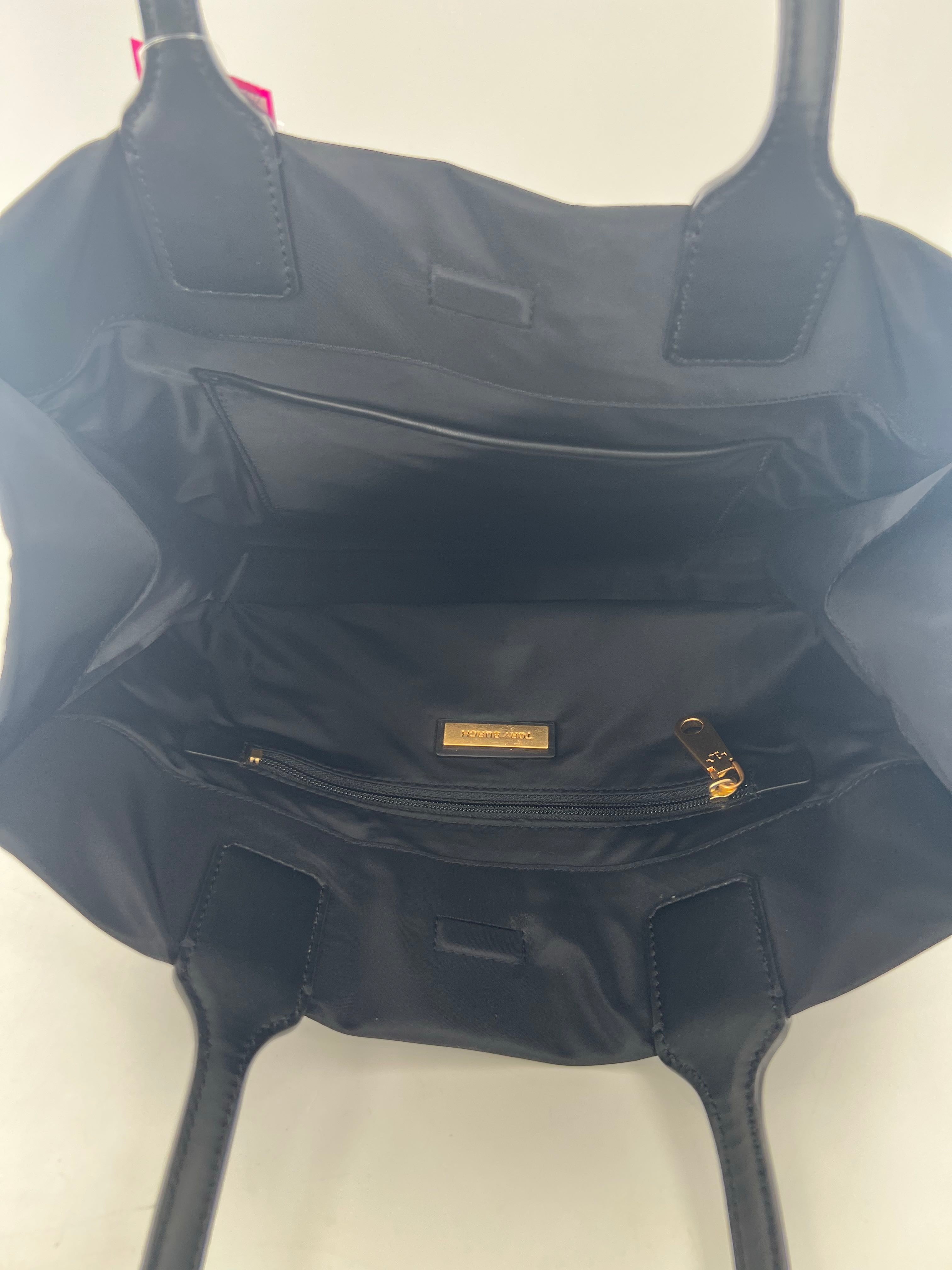 circular studded logo magnetic closure tote