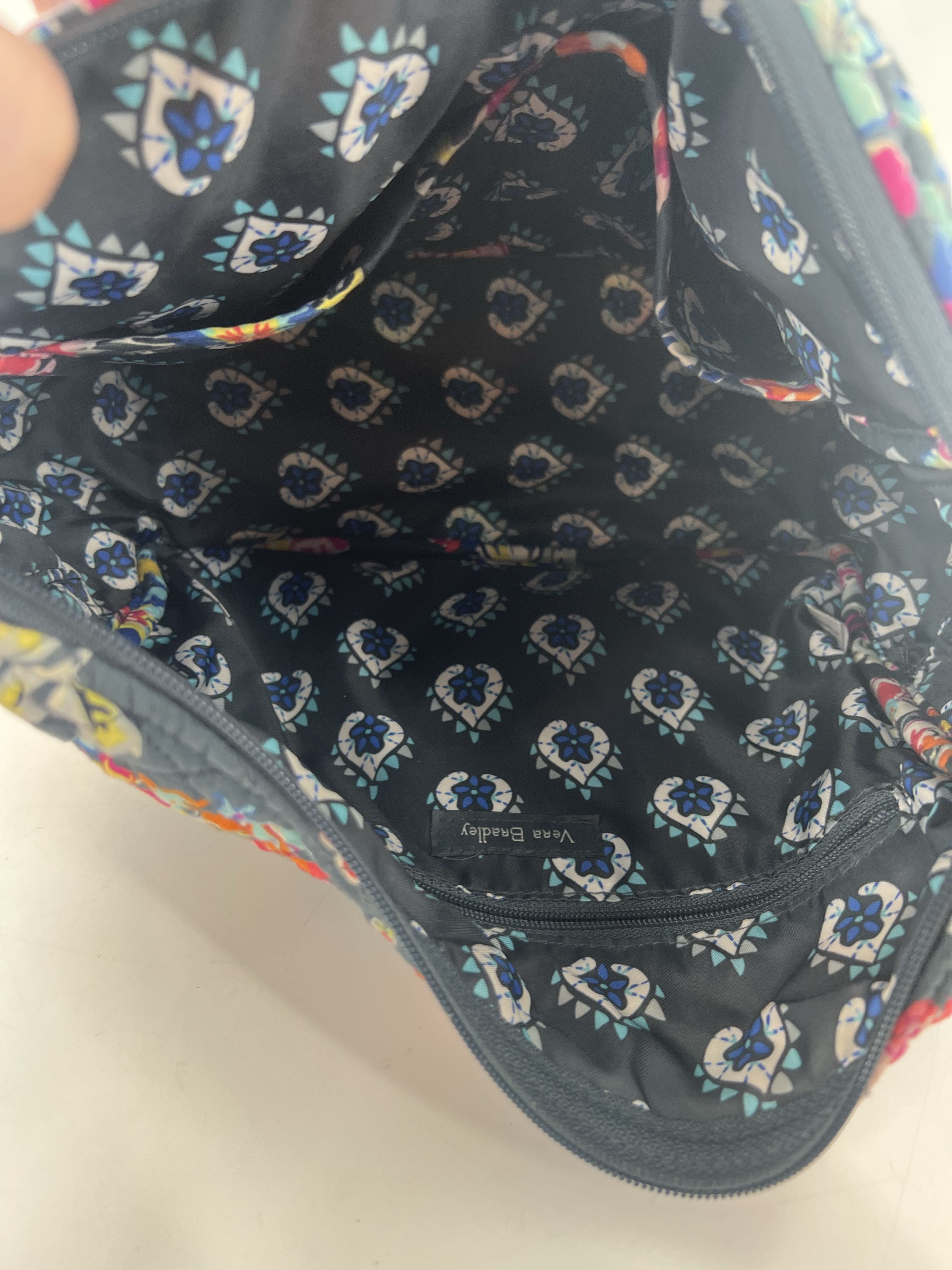 quilted floral zip front pocket crossbody